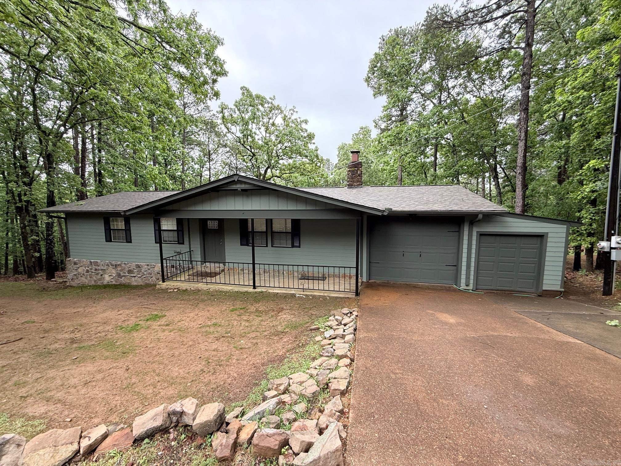 Check out this adorable fully FURNISHED lake house! Located less than one mile from Fairfield Bay Marina. An airy floor plan that seamlessly connects the living, dining, kitchen and spacious sunroom, making it perfect for entertaining. Enjoy a partial lake view from the upper or lower decks. Outdoor fire pit perfect to savor lake life. Bonus room downstairs that could be used as an additional bedroom or storage! Fairfield Bay provides 3 swimming pools, golf courses, tennis, bowling and countless ATV trails! Primary bedroom offers on ensuite bathroom with his and hers closets. Also included with this home is and adjacent parcel on Lakeside Road to ensure even more privacy! Brand new roof, new deck, new fieldstone, new water service and new paint! This home has everything you need for your Happy Place! Call Today!