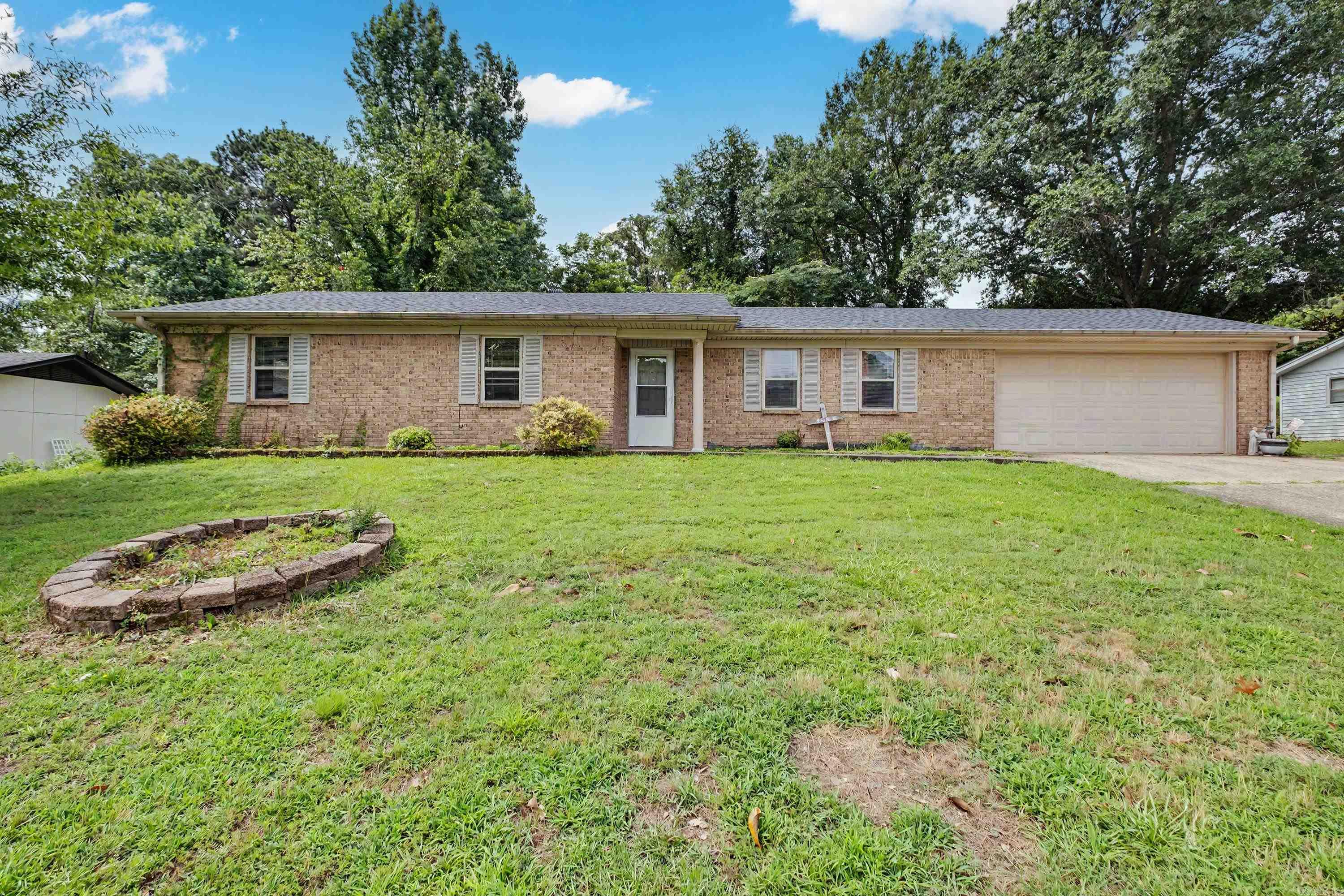Welcome home to this charming 3bd, 2 bath property that offers comfort, space, and features the whole family will love. Step inside to a warm inviting living room with a cozy fireplace, perfect for relaxing evenings. The formal dining room provides an ideal space for hosting family dinners and holiday gatherings located in the Bryant School District