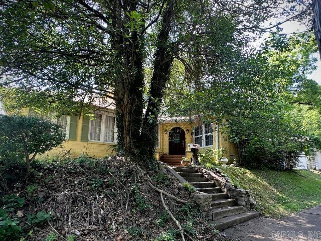 Charming fixer-upper in the coveted Quapaw Prospect Historic District.  This 3 bedroom, 1 bath home sits on a large double lot in a prime location near the West Mountain entrance to Hot Springs National Park.  Original hardwood floors add a touch of classic charm while a mudroom covered carport off Fawn St offers a convenient side entrance.  The spacious yard holds lots of potential for lush flower gardens and outdoor entertaining.  While the home needs some TLC, it is a perfect project for an astute investor or a buyer looking to customize their dream home in this historic neighborhood.  Outstanding opportunity to own a piece of Hot Springs history.