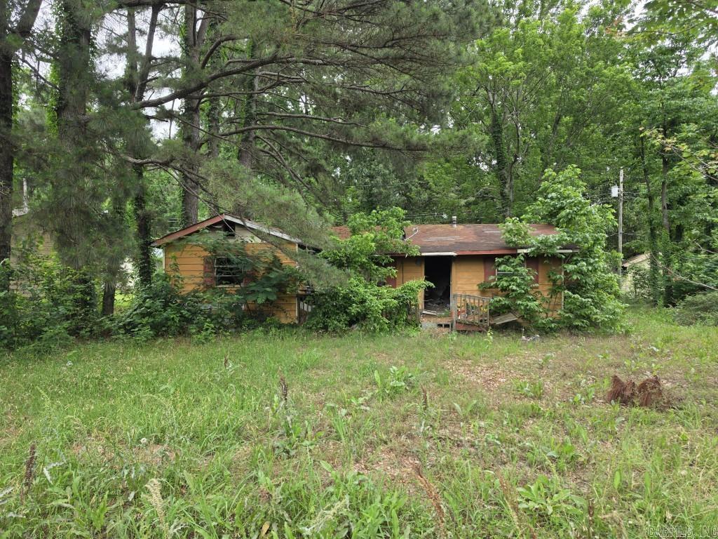 The house on the property needs to be torn down, but could be a good building lot in a secluded neighborhood.