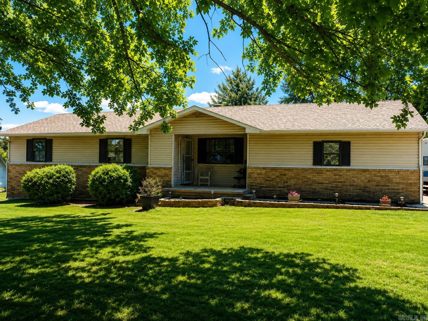 Welcome to this well-maintained 1,311 sq ft home, perfectly situated on a spacious corner lot in a desirable, established neighborhood. This inviting property features 3 comfortable bedrooms and 1.5 baths, offering plenty of space for family living or entertaining guests. Step inside to find a cozy living area highlighted by a beautiful fireplace, perfect for relaxing evenings at home. The layout provides both functionality and comfort, making it easy to settle in and make it your own. New thermal pane windows add energy efficiency and comfort year-round.  Outside, enjoy a fully fenced back yard ideal for pets, kids, or private outdoor gatherings. You’ll also love the oversized garage, perfect for extra storage, a workshop, or multiple vehicles. The corner lot enhances curb appeal and provides added outdoor space.  Conveniently located just minutes from shopping, dining, and everyday amenities, this home offers comfort, location, and value. Schedule your showing today!