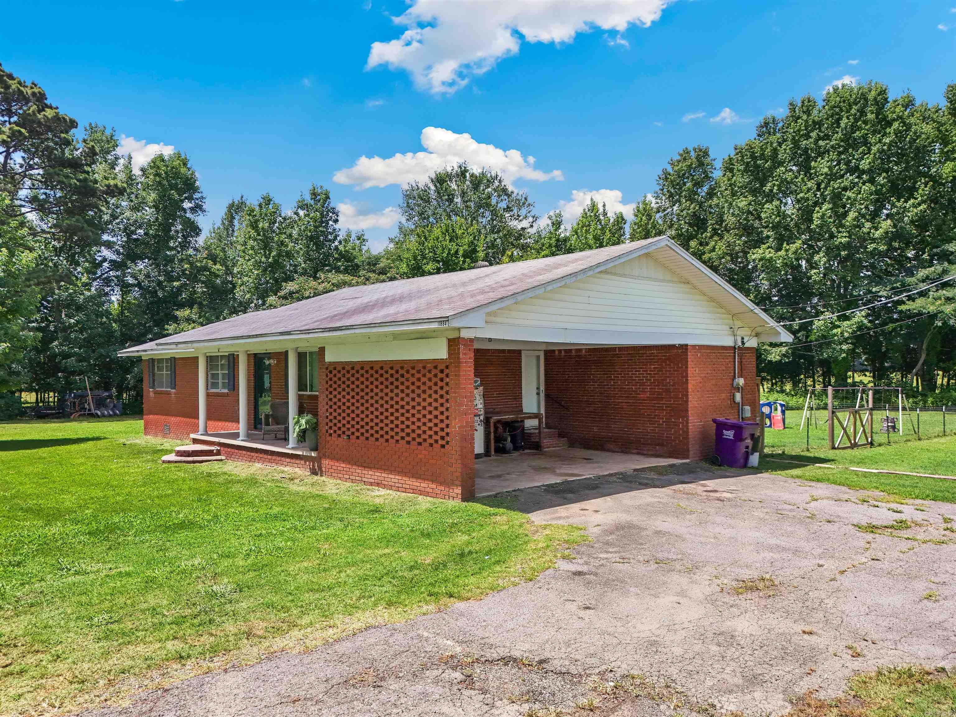 Well maintained cute home on a cleared 1.66 acres.  Back yard is fenced for pets. A 2 car carport, nice back porch, and very usable yard.  This house is ready for a young family or someone just wanting to get out of the city, no close neighbors and an open field across the road.