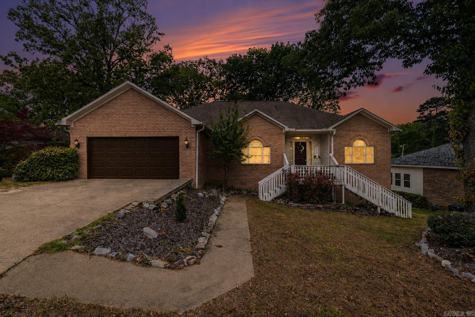 This well-maintained brick home offers a spacious and great floor plan perfect for comfortable living and entertaining. Featuring 4 bedrooms, 2 bathrooms, 4th bedroom is upstairs loft measuring 14' x 35'. The home includes granite countertops in the kitchen, a convenient 2-car garage, a dedicated laundry room, and peaceful sun porch to relax and watch the sunset on Lake Hamilton.  Below the main level, a LARGE workshop offers excellent space for hobbies, projects, or additional storage, along with adjoining unfinished multi-purpose areas ready to be customized to fit your needs whether for a home gym, studio, or extra living space.  Located in the desirable Lake Hamilton School District, this property combines space, flexibility, and potential all in a great location. HOA includes private Boat slip access on Anderson St.