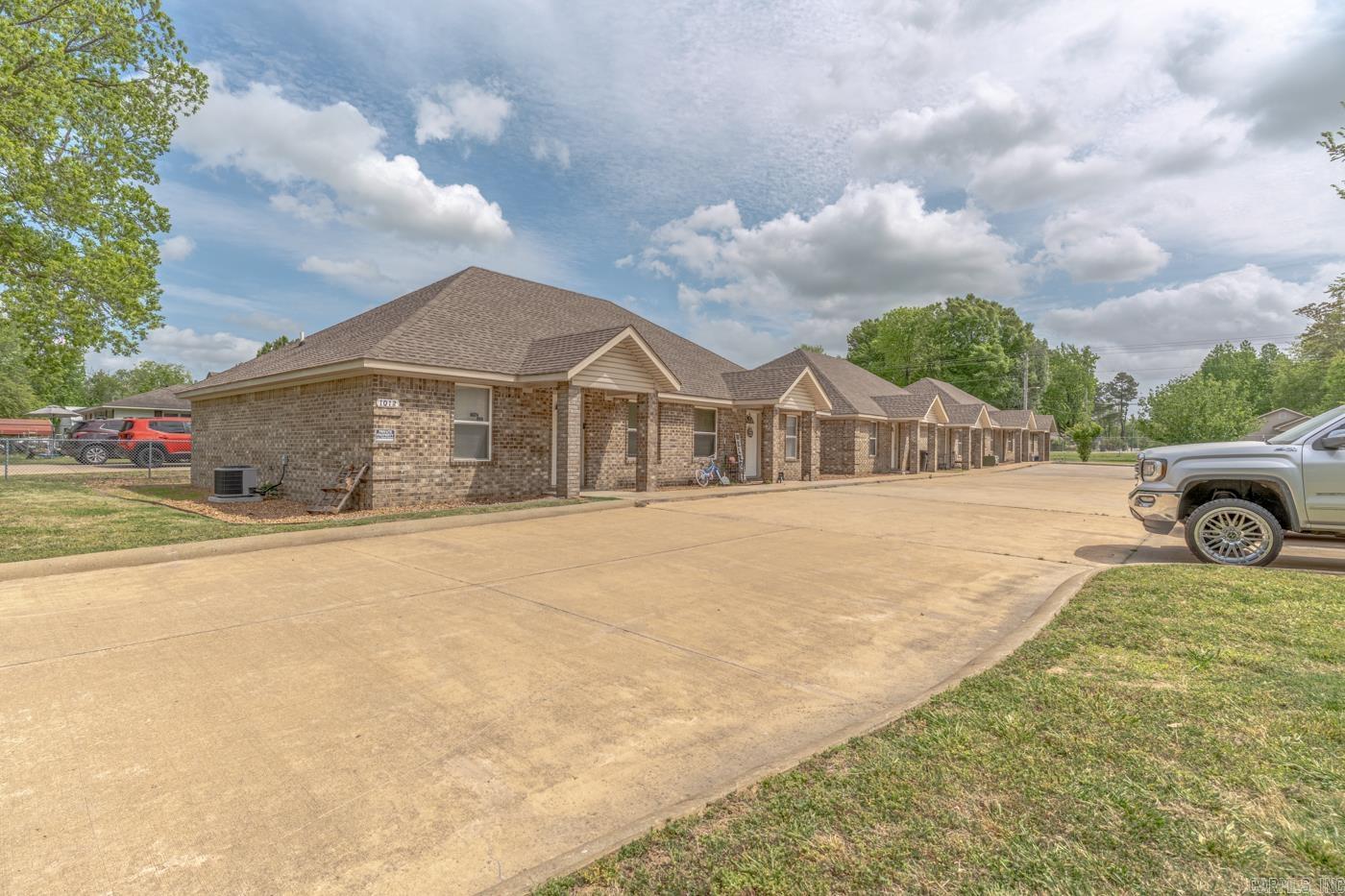 Welcome to Market 1012 N Main St. of the Brookerson Replat in Jonesboro, Arkansas within the Jonesboro School District. Opportunity Knocks with all 6 units currently occupied. Situated on a R-3 zoned .57 +/- acre lot are three 2018-built duplexes. The exterior of each duplex is wrapped in brick, topped with architectural shingles, and accented by covered front porches, parking, and fencing. The interior of each unit features 990 sf +/- of well laid out living space and contains a large living room with tray ceiling, kitchen with electric range, built-in microwave, dishwasher, and access to the backyard. Two generous bedrooms, full bathroom with shower/tub combo, and laundry room complete the layout. You'll love the granite countertops & concrete flooring throughout, and the built-in shelving in the closets. All appliances convey, electric meters are separate, and Owner pays utilities and cable. Conveniently located near downtown and favorite local amenities. Call today to schedule your tour and make an investment in tomorrow.