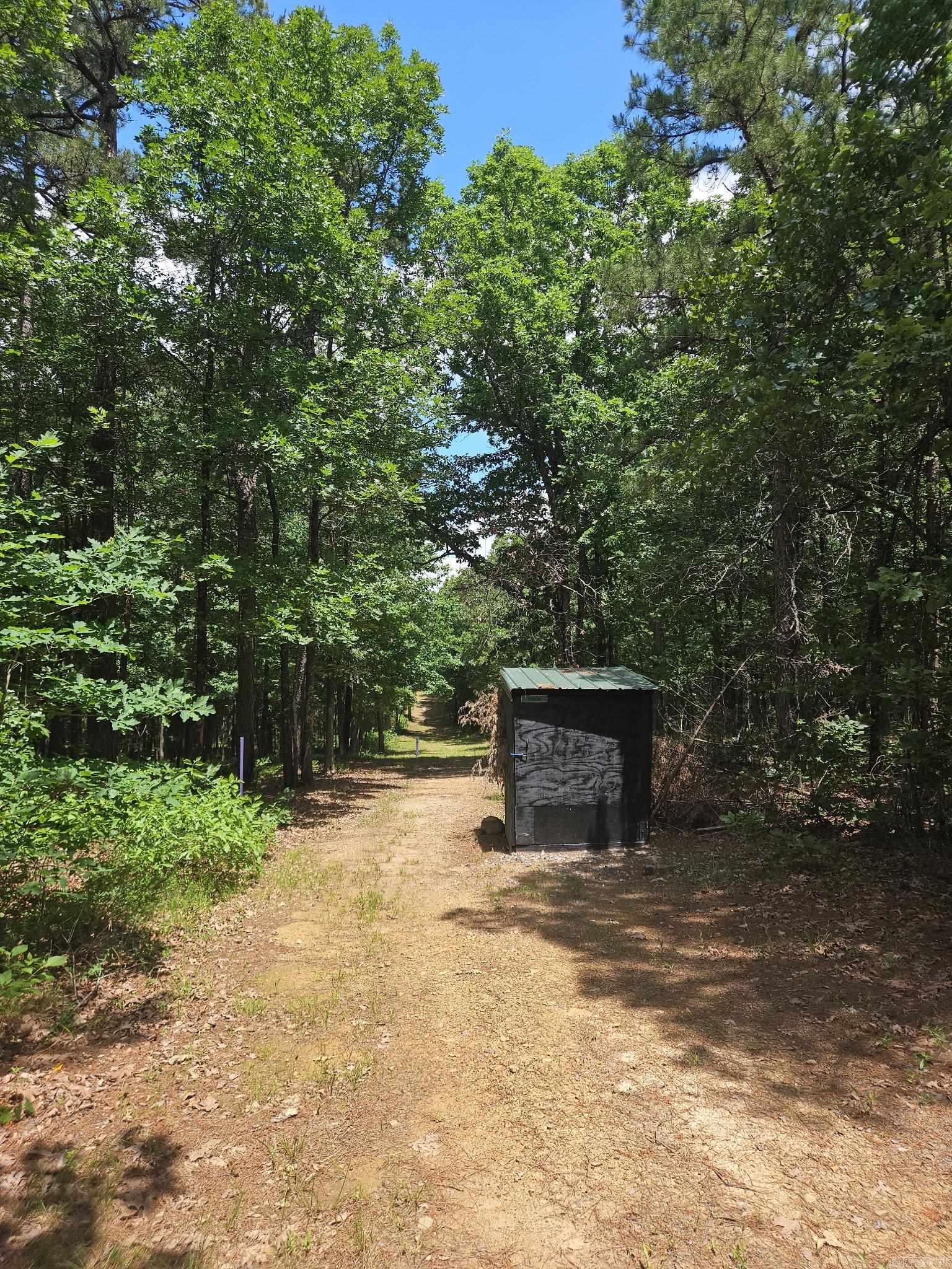 Live on your property while you build your dream home!! After your dream home is built the small home and can be sold for extra funds! Perfect set up for those wanting gorgeous property to build!! Outdoor paradise with an AMAZING VIEW!! This 15 acres sits at the end of the road, and is surrounded on three sides by the Maumelle River Wildlife Management Area. You have private access to 1,000's of acres of public hunting land. The land is mature timber, with dozens of huge old White Oaks scattered throughout. A permanent deer hunting blind is a nice bonus. The property has been managed for wildlife and it shows! The turkey pictures were taken from the living room window! Total privacy with city water, 2 choices of fiber internet, and trash pickup. You are only 25 minutes from both Conway and West Little Rock. Multiple building sites with a view you will never tire of! This property is a dream for outdoor enthusiast, and because of the public land surrounding , you will always have privacy!
