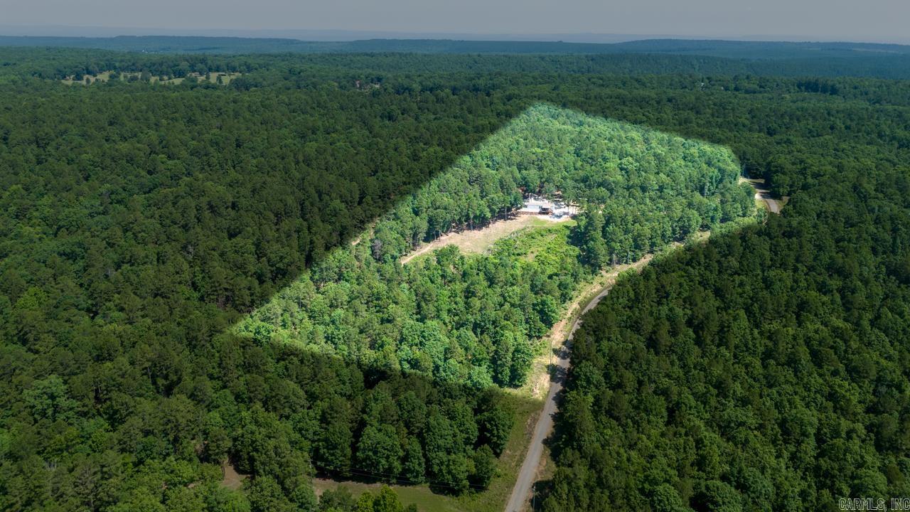 Outdoor paradise with an AMAZING VIEW!! This 15 acres sits at the end of the road, and is is surrounded on three sides by the Maumelle River Wildlife Management Area. You have private access to 1,000's of acres of public hunting land. The land is mature timber, with dozens of huge old White Oaks scattered throughout. A permanent deer hunting blind is a nice bonus. The property has been managed for wildlife and it shows! The turkey pictures were taken from the living room window! Total privacy with city water, 2 choices of fiber internet, and trash pickup. You are only 25 minutes from both Conway and West Little Rock. Multiple building sites with a view you will never tire of! This property is a dream for outdoor enthusiast, and because of the public land surrounding , you will always have privacy!