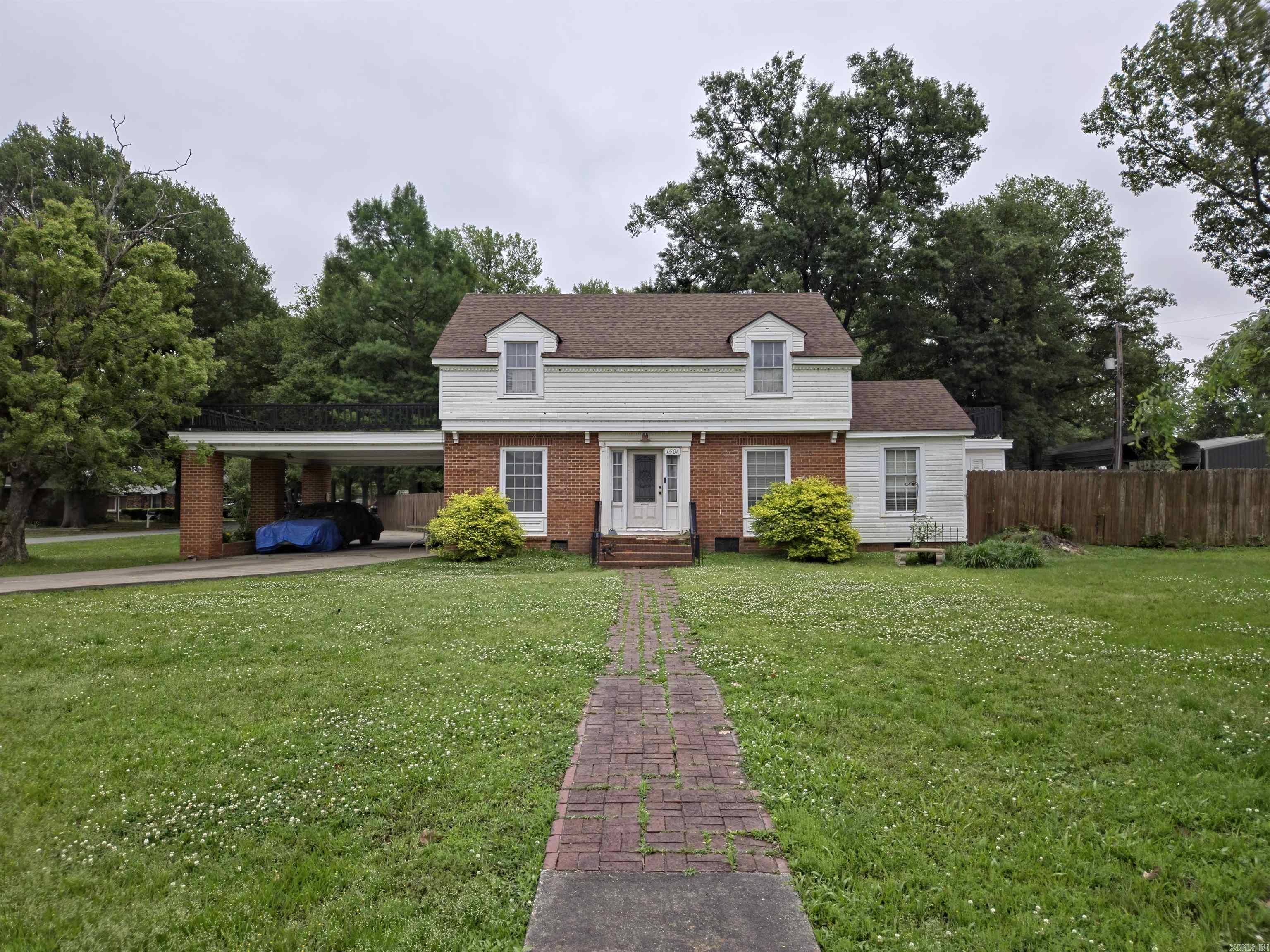 This spacious home features 4 bedrooms and 3.5 bathrooms, plus a versatile bonus room, floored attic space, and a separate laundry area—well-suited for large or multi-generational living. Situated on a corner lot with generous road frontage, the property also offers a fenced backyard with ample space for outdoor gatherings and entertaining.  With solid square footage and a flexible layout, this home presents a great opportunity for buyers looking to customize and add value. It may qualify for renovation financing options such as an FHA 203(k) or conventional renovation loan.  Agents see remarks.  The property is being sold as-is, and pricing reflects its current condition. Cash offers are encouraged. Known condition issues—please see agent remarks and seller disclosure for additional details.