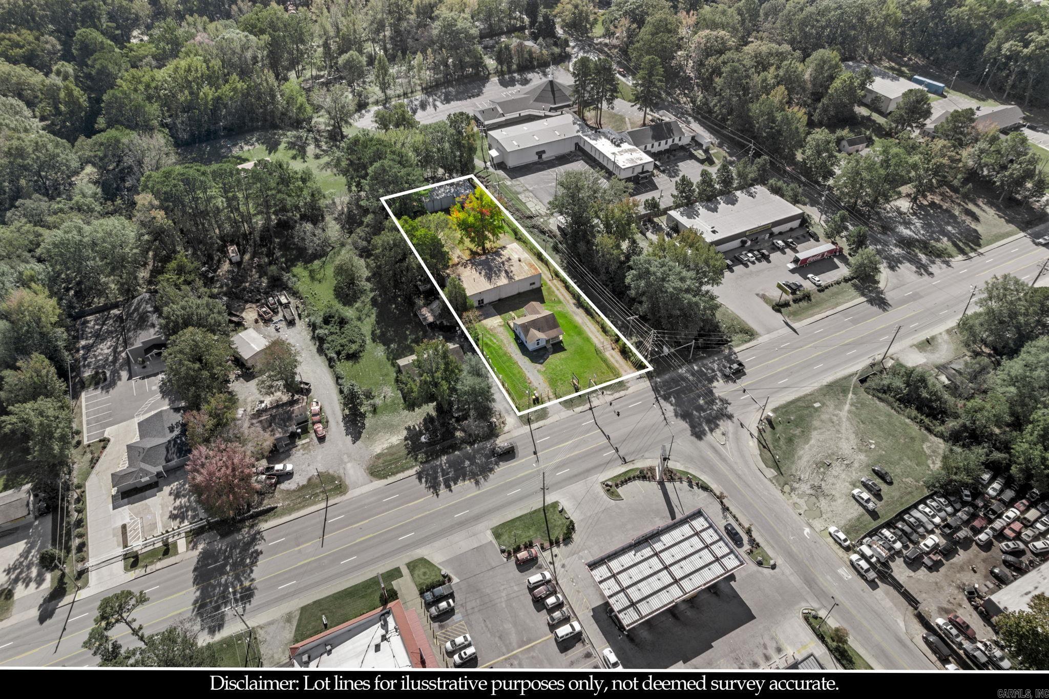 Unique commercial opportunity with endless potential in a high-traffic SW location. Zoned C-3, this income-producing property includes three buildings across 4919, 4921, and 4923 Baseline Rd, ideal for investors, business owners, or organizations seeking flexible space.  The first building is a detached 3-bedroom, 1-bath home featuring tile and wood flooring, plus central heat and air—perfect for rental income or on-site living. The second building is a spacious event center, gymnasium, or worship hall with men’s and women’s public restrooms, two office spaces, and a full kitchen, making it suitable for gatherings or business use.  The third building is a metal structure that can be used as a warehouse, storage facility, or other commercial purpose. With multiple structures and strong visibility, this property offers excellent potential for multi-use income streams or business expansion.