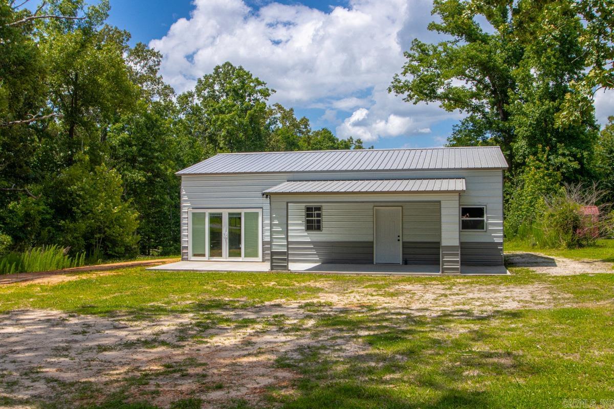 Don't miss this incredible opportunity to own a virtually brand-new, one-year-old barndominium nestled on approximately 1.34 unrestricted acres in the highly desirable East End area! Free from the confines of subdivision rules, this stunning property offers the ultimate freedom of country living combined with sleek, modern design that still feels like the day it was built. Inside, you'll find a beautifully maintained three-bedroom, one-bathroom layout highlighted by a bright and spacious open-concept kitchen, living, and dining area perfectly suited for effortless entertaining and everyday comfort. Having only been gently used as a short-term rental, every corner of this unique home remains in pristine, absolute showroom condition, making it a rare, turn-key gem ready for you to move right in and make it your own!