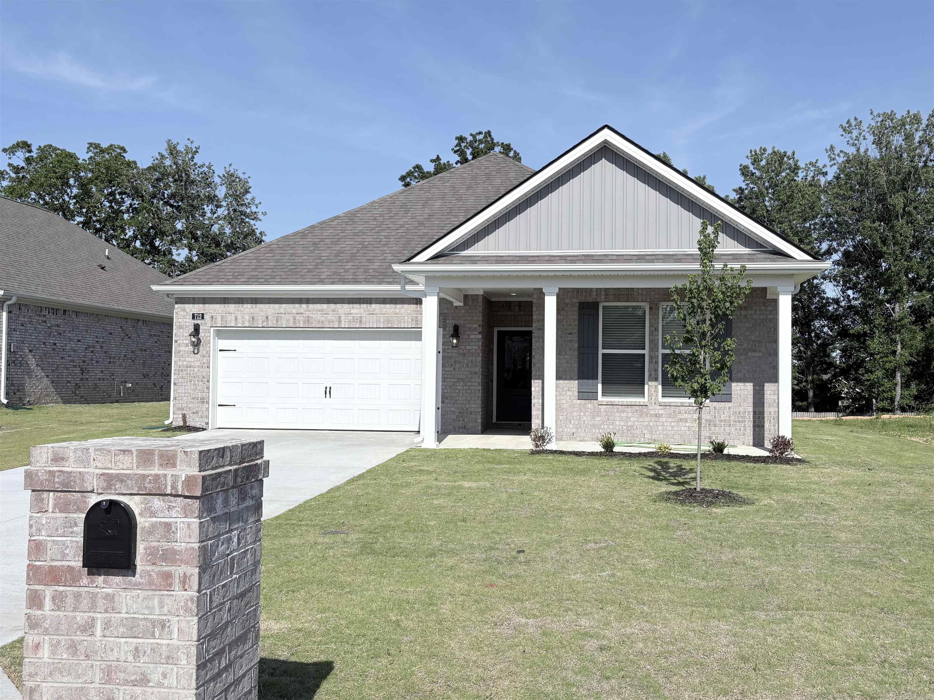 MOVE-IN READY! The appealing one-story home includes many contemporary features.  An open-concept design including 9' ceilings enhance the wonderful feel of this home. The kitchen includes a large counter perfect for bar-style eating or entertaining, a spacious pantry and plenty of cabinets and counter space. The large living room overlooks the patio, which is a great area for relaxing and dining al fresco. Bedroom One, located at the back of the home for privacy, can comfortably fit a nice size bed, and includes an en suite bathroom with a vanity and big walk-in closet. Pictures, photographs, colors, features, and sizes are for illustration purposes only and will vary from the homes as built. Additional Features include: granite countertops, kitchen appliances provided are refrigerator, stove, microwave, dishwasher, electric fireplace, brick, gutters, blinds, double sinks in master, walk in shower, 2 car garage, 10 year warranty.  Photos are for illustration purposes only.