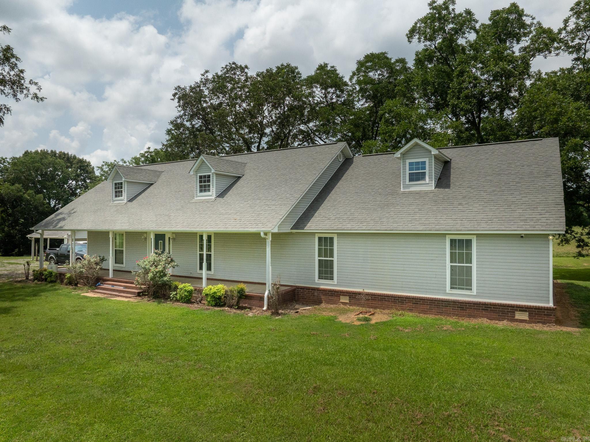 20 Acres ± | Country Home & Homestead  If you've been searching for a place where you can enjoy the peace of country living without sacrificing comfort, this beautiful 20-acre homestead deserves a look.  Tucked into a picturesque setting, the home is surrounded by mature shade trees, including towering pecan trees behind the house and a magnificent oak anchoring the front yard. From the sunroom and back of the home, you'll enjoy peaceful views overlooking a creek and fenced pasture, creating the kind of setting that's becoming increasingly difficult to find.  Originally constructed in 1997, the home was thoughtfully expanded in 2015 with an additional 1,100 to 1,200 square feet, bringing the total living space to approximately 2,746 square feet. The spacious floor plan includes three oversized bedrooms, two and a half bathrooms, and a dedicated office that could easily serve as a fourth bedroom if desired.  Designed with everyday functionality in mind, the home features a mudroom, a bright sunroom, and zoned heating and air provided by two separate HVAC units for added comfort and efficiency. The kitchen comes complete with the refrigerator, dishwasher, electric range, and microwav