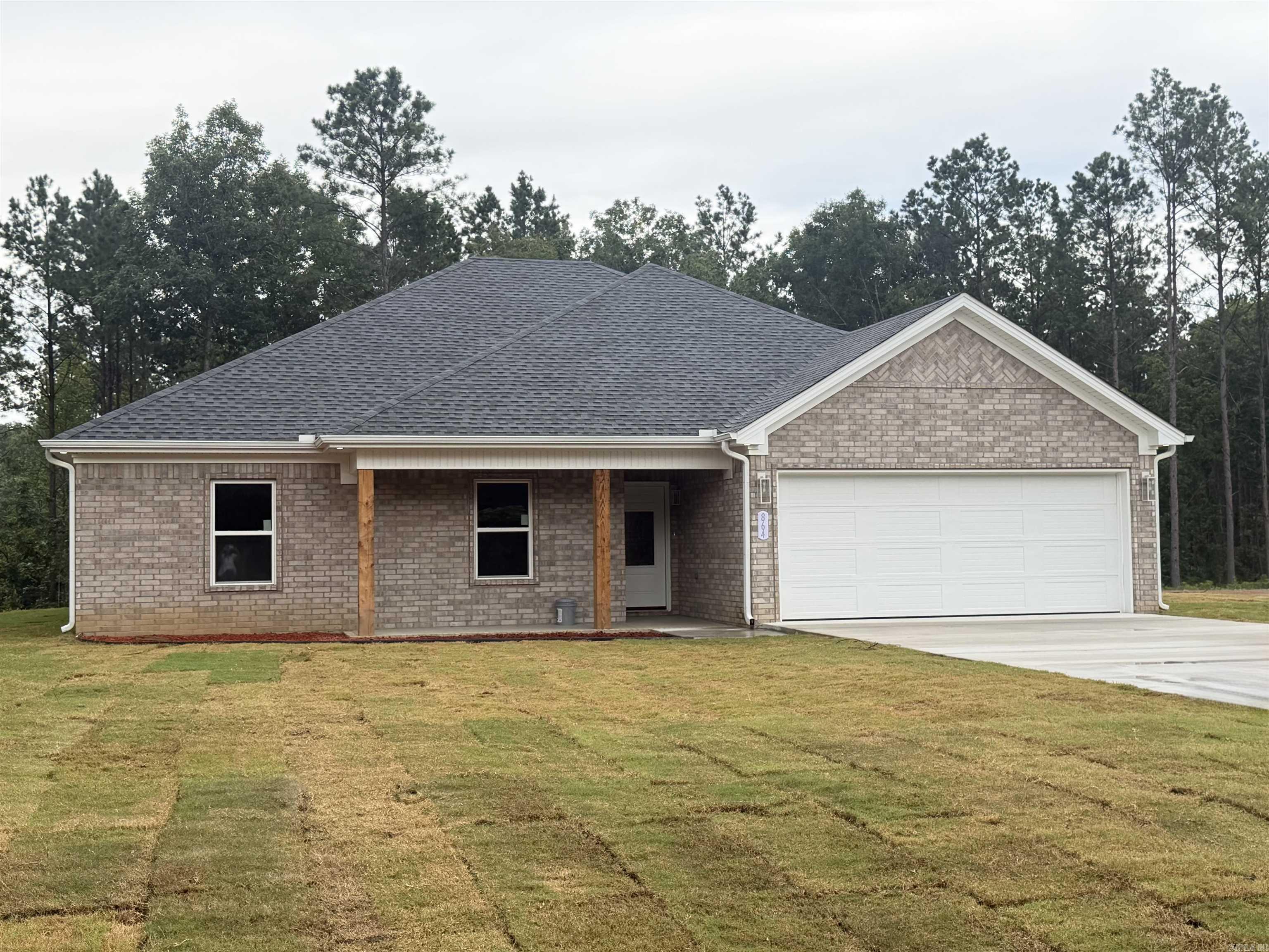 Welcome to 864 Grant 58!! This beautiful all brick home is situated on 2.23 acres and features 4 bedrooms and 2 bathrooms! When you walk inside you'll find an open split floor plan with luxury vinyl plank flooring throughout the whole house! Cozy gas fireplace, stainless steel appliances in the kitchen with a gas stove. You'll also find a spacious primary that flows into the bathroom with a tile walk-in shower, soaking tub, his and her vanities, and large walk- in closet! When you step in the backyard you'll  find the spacious back patio overlooking peaceful wooded views! You don't want to miss this one!! Schedule your showing today!!