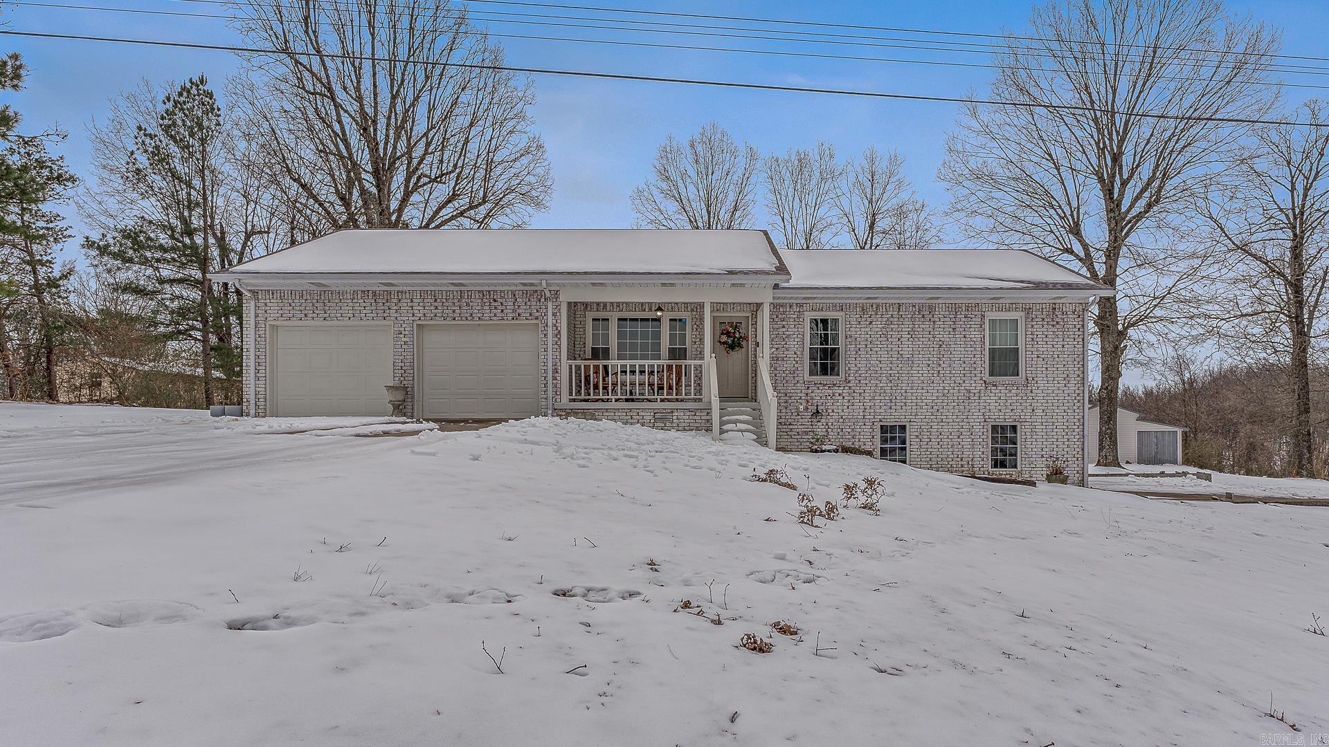 This beautifully remodeled home offers the perfect blend of modern updates and spacious living. Featuring 5 bedrooms and 3 bathrooms, it provides plenty of room for families to grow and entertain. Inside, you’ll find fresh paint, all-new flooring and carpet, stylish finishes, and a thoughtful layout with two living areas. The updated kitchen showcases solid surface countertops, new appliances, a tile backsplash, and flows seamlessly into the dining area—perfect for gatherings. A cozy gas fireplace adds warmth and charm.  Additional interior highlights include large bedrooms with generous closet space, a convenient downstairs laundry room, and abundant storage throughout. Outside, enjoy 2.1 acres with plenty of space to relax, play, or work. The two-car garage and additional outbuilding/workshop provide excellent storage and workspace.  Major improvements include a new roof in 2020 and much more.