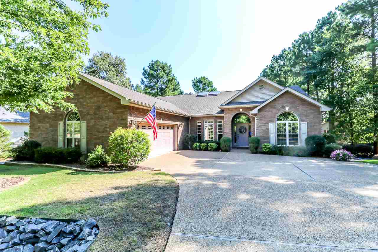 BEAUTIFUL, PRIVATE SETTING ON LAKE ESTRELLA.  LARGE COVERED DECK TO ENJOY LAKE AND NATURE. VAULTED CEILING AND WALL OF WINDOWS LOOKING FROM KITCHEN, GREAT ROOM, AND BREAKFAST AREA TO LAKE.  BEDROOMS ARE DIVIDED AND 2-1/2 BATHS.  FORMAL DINING.  OVERSIZE 2 CAR GARAGE - EASILY ACCOMMODATES 2 CARS, GOLF CART, AND WORK AREA. LARGE MASTER SUITE WITH HIS/HER CLOSETS.  HOUSE IS LIKE NEW!