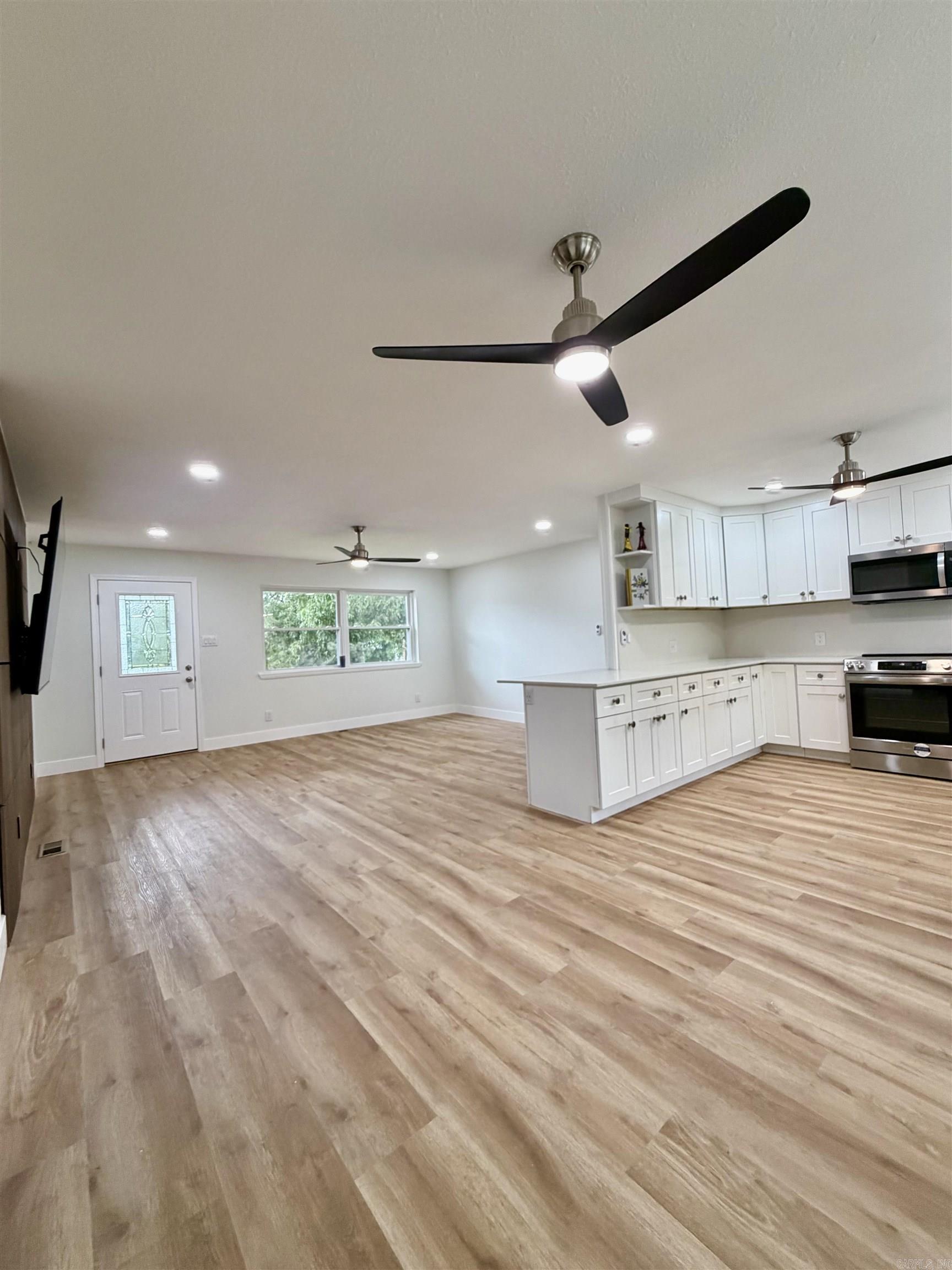 Seller is offering a $10,000 credit to buyers for the month of June.  This updated 4-bed, 2-bath home in the highly desired Lake Hamilton School District perfectly blends comfort and convenience. It features a 85 inch TV, new custom kitchen and two new bathrooms with walk-in shower, new flooring throughout the house. All new appliances and LED lights and fens. Fully fenced backyard ideal for kids and pets run and play.