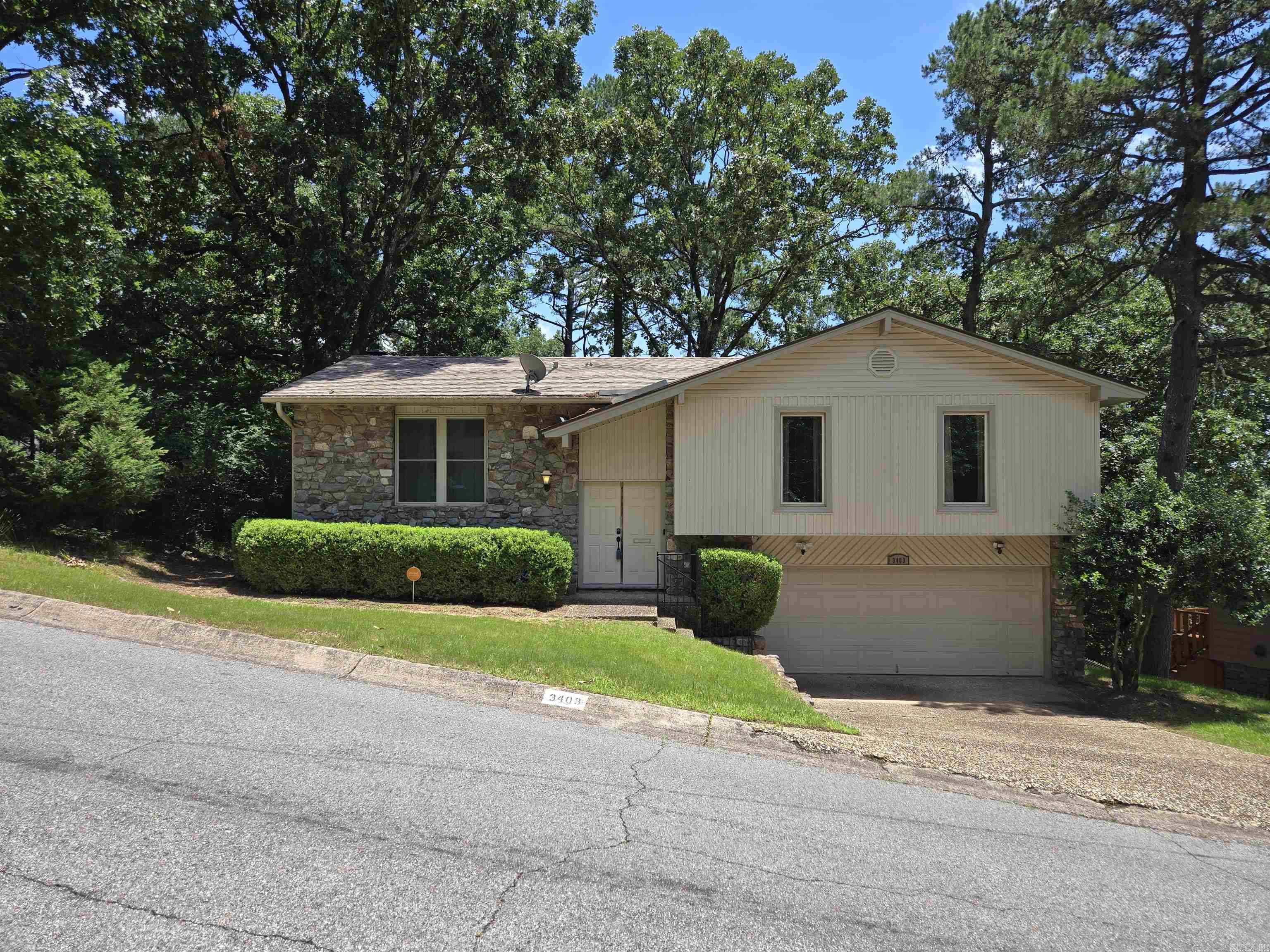 Great location! Beautiful home with maintenance free exterior all ready for new owners! Top level has spacious eat-in kitchen and dining area with large new outdoor deck for entertaining, living room, 3 bedrooms and 2 full bathrooms. Downstairs has very large bonus room, spacious den with rock fireplace and wet bar, a half bath, double car garage and laundry/storage room. Conventiently located to various schools, shopping and entertainment. Also very close to Three Rivers Trail for hiking and biking!