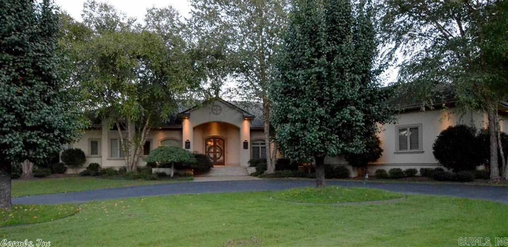 Luxurious contemporary home and guest house with privacy and seclusion. This John Ulmer custom built home has been featured several times in local designer magazines. Quality surrounds you from the concrete tile roof to the spectacular gourmet kitchen with solid cherry cabinets and heated limestone floors. Features  computerized lighting, Sub Zero appliances and a view from every room of the pool with waterfall or the 25 acres covered with wildlife and ponds. Large shop. Additional land may be purchased.