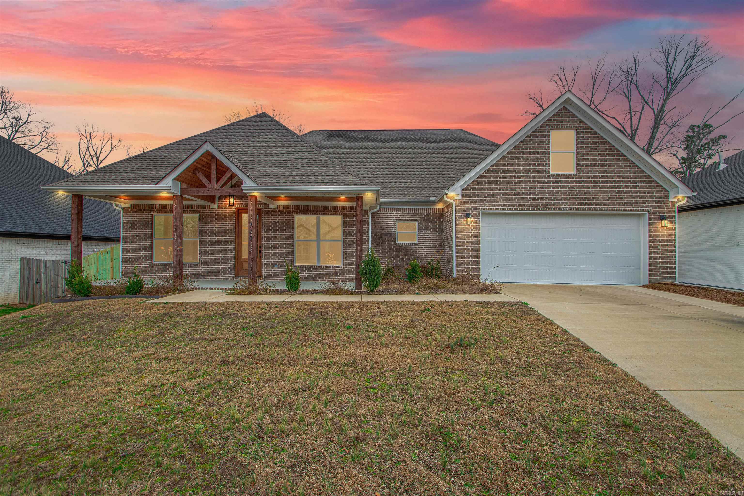 This thoughtfully designed new construction home is filled with natural light and intentional details, set within the desirable Harmony Village neighborhood just minutes from everything Benton has to offer. High ceilings create an airy, welcoming feel throughout the open living and kitchen spaces, where an open kitchen layout and butler’s pantry make both everyday routines and entertaining feel effortless. A dedicated office provides the flexibility to work from home or serve as a fourth bedroom as life evolves. The primary suite is a true retreat, featuring a spa like bathroom with a soaking tub, walk in shower, and a pass through laundry room that leads directly into a massive walk in closet designed for ease and organization. Outside, the covered back porch with an outdoor fireplace becomes the heart of the home in every season, offering a place to unwind or gather as the sun sets. The fully fenced backyard adds privacy and room to relax, play, or garden. This home blends modern comfort with timeless livability in a location that keeps you close to everything while still feeling settled and serene. Book your private tour today!