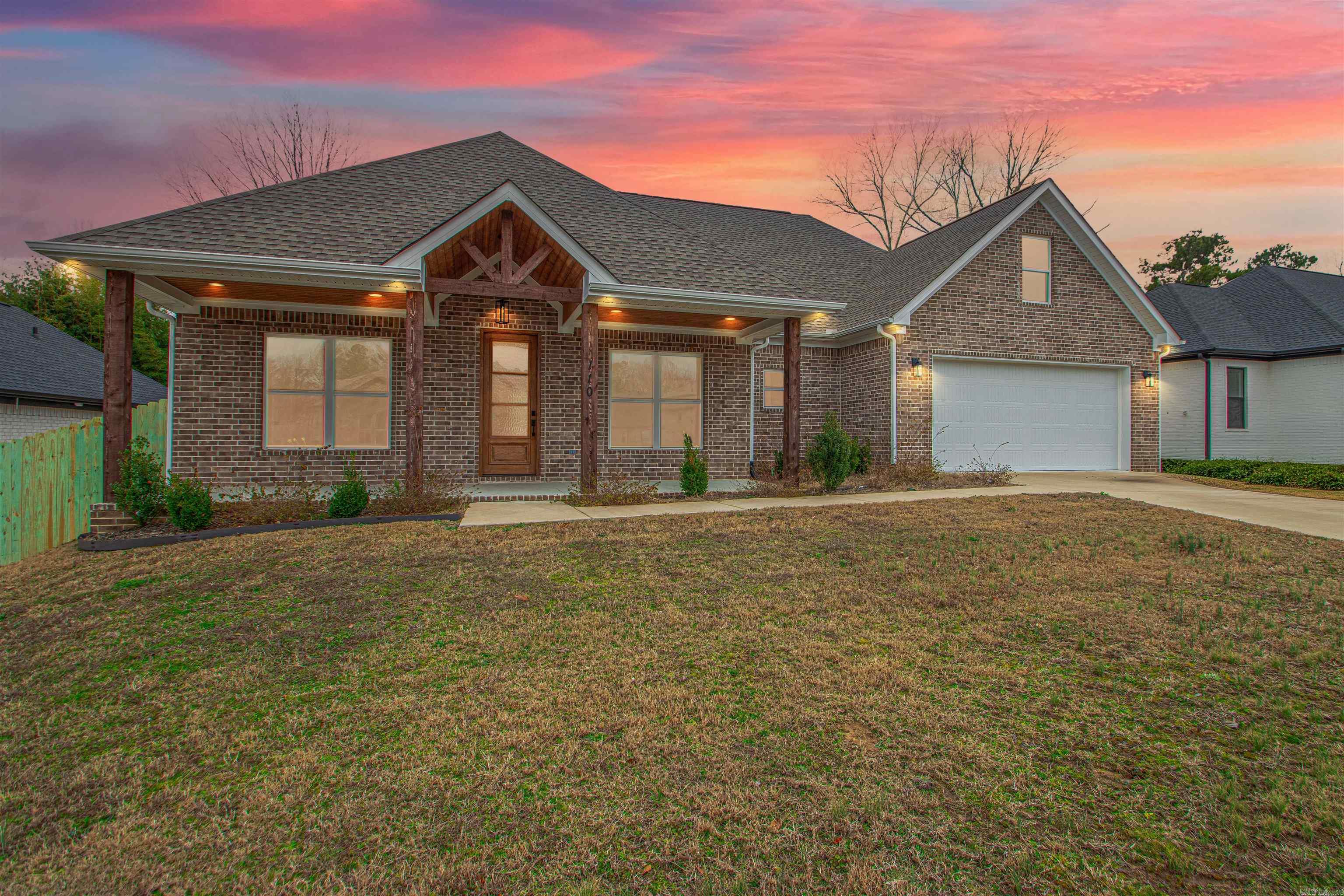 This thoughtfully designed new construction home is filled with natural light and intentional details, set within the desirable Harmony Village neighborhood just minutes from everything Benton has to offer. High ceilings create an airy, welcoming feel throughout the open living and kitchen spaces, where an open kitchen layout and butler’s pantry make both everyday routines and entertaining feel effortless. A dedicated office provides the flexibility to work from home or serve as a fourth bedroom as life evolves. The primary suite is a true retreat, featuring a spa like bathroom with a soaking tub, walk in shower, and a pass through laundry room that leads directly into a massive walk in closet designed for ease and organization. Outside, the covered back porch with an outdoor fireplace becomes the heart of the home in every season, offering a place to unwind or gather as the sun sets. The fully fenced backyard adds privacy and room to relax, play, or garden. This home blends modern comfort with timeless livability in a location that keeps you close to everything while still feeling settled and serene. Book your private tour today!