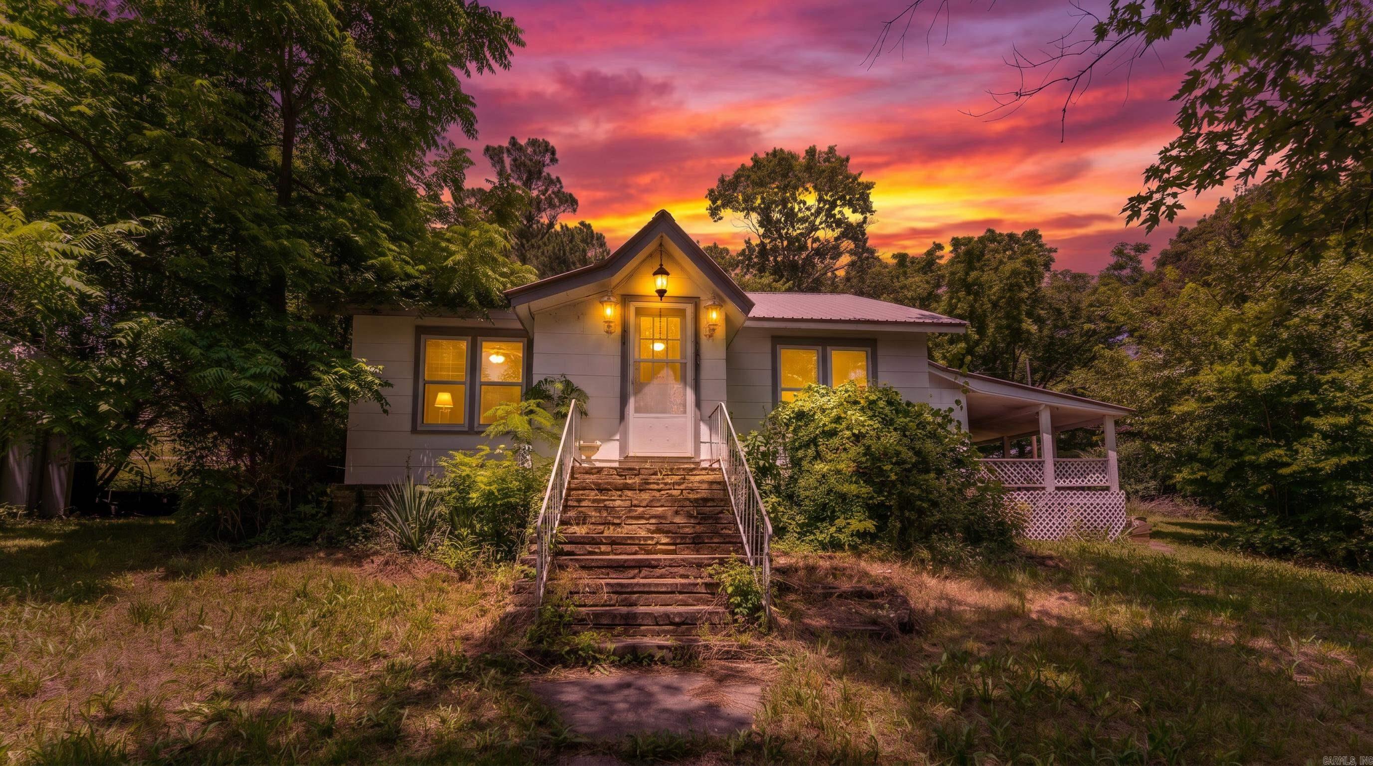 Versatile Home with Income Potential in Mammoth Spring Located on a desirable corner lot in the heart of Mammoth Spring, Arkansas, this 3-bedroom, 2-bathroom home offers the perfect blend of comfortable living and outstanding income potential. The main home features a functional layout with plenty of space for everyday living, while the separate living quarters make this property truly unique.  Complete with a private entrance and separate utilities, the additional living space is ideal for extended family, guests, a long-term rental, or a short-term vacation rental, subject to local regulations. This flexible setup offers an excellent opportunity to generate additional income or accommodate multi-generational living.  Conveniently located just minutes from restaurants, shopping, schools, parks, and Mammoth Spring State Park, and the famous Spring River.