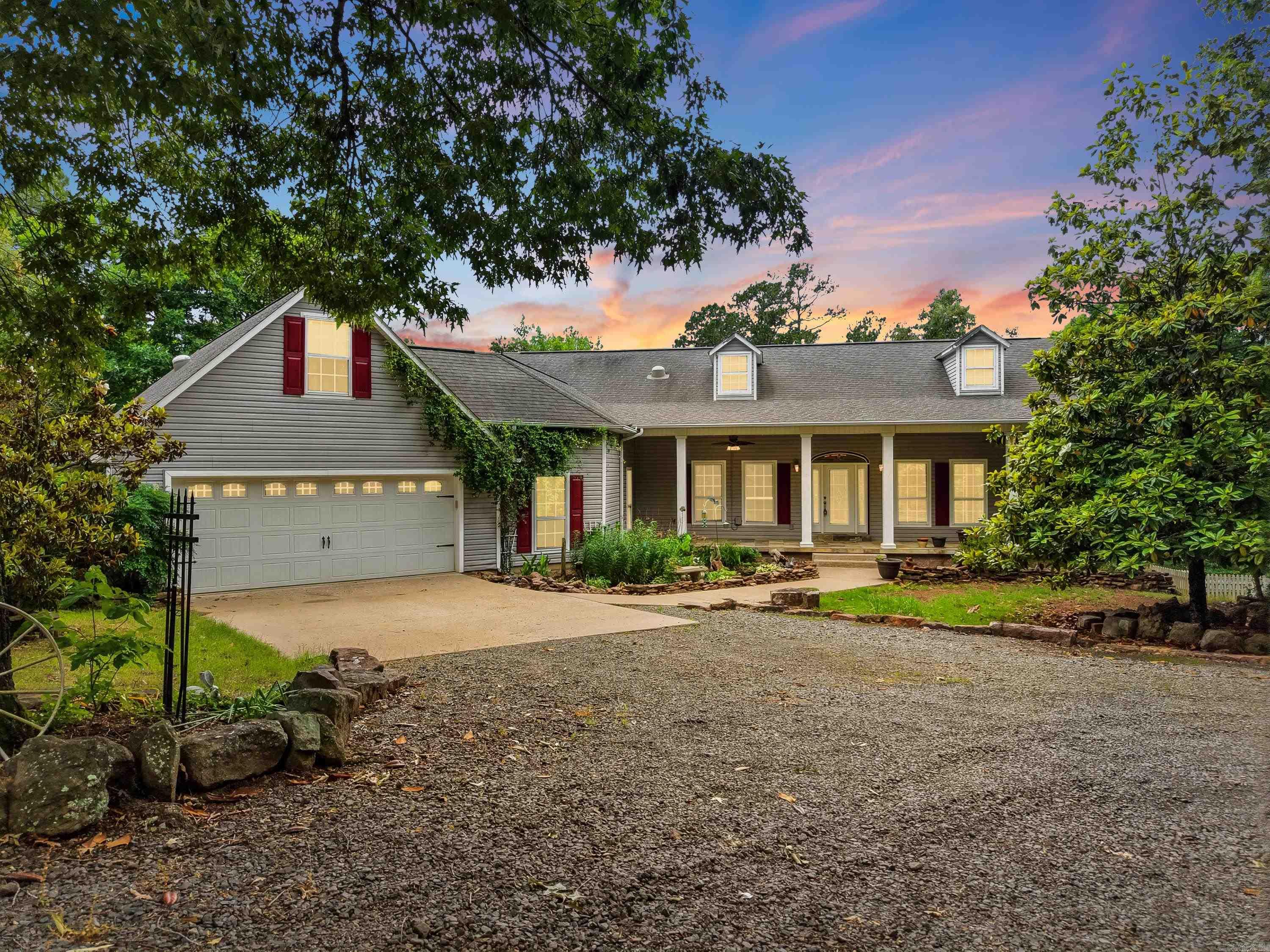 Tucked away in the Ozarks on 40 breathtaking acres, this one-of-a-kind property offers the peace, privacy, and freedom so many dream about. Just minutes from Greers Ferry Lake, Fairfield Bay Marina, ATV/UTV trails, and all the amenities of the Bay, you can enjoy adventure and relaxation in equal measure. Wander the private trails that wind throughout the acreage, pick fresh cherries, wild plums, strawberries, and muscadines, or spend evenings in the garden surrounded by nature’s beauty. The wraparound porch, screened sitting area, grilling space, and sparkling swimming pool create the perfect setting for gathering with family and friends or simply soaking in the quiet. Children will love the fenced play area while the pole barn and attached workshop offer endless possibilities. Inside, you’ll find soaring 10-foot ceilings, a spacious utility/laundry room that also serves as a safe room, generator hookup for peace of mind, and updated HVAC systems for comfort year-round. Best of all, this private retreat is remarkably free of mosquitoes, allowing you to fully enjoy the outdoors from sunrise to sunset. This isn’t just a home—it’s a lifestyle. Some photos have been virtually staged.