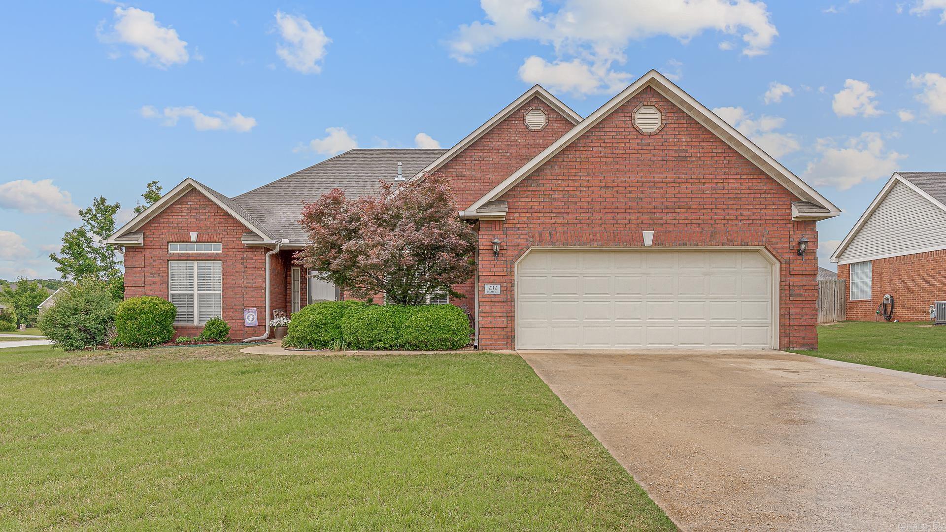 Welcome home to this beautifully maintained all-brick residence tucked away on a spacious corner lot in the peaceful Griffin Park Subdivision. Inside, the oversized living area showcases rich hardwood flooring, soaring ceilings, and a cozy corner fireplace that creates the perfect gathering space. Just off the main living area, the formal dining room is highlighted by elegant transom windows that flood the space with natural light. The kitchen is designed for both functionality and everyday living, featuring plentiful stained wood cabinetry, breakfast bar seating, and a separate dining nook ideal for casual meals. The thoughtfully designed split-bedroom floor plan provides a private primary retreat complete with a tray ceiling, spacious en suite bath with double vanities, jetted soaking tub, and a large walk-in closet. Step outside to enjoy the fenced backyard and patio area, conveniently located just off the kitchen — perfect for relaxing evenings or entertaining guests. Located within the highly sought-after Valley View School District, this property combines comfort, style, and a desirable location all in one.
