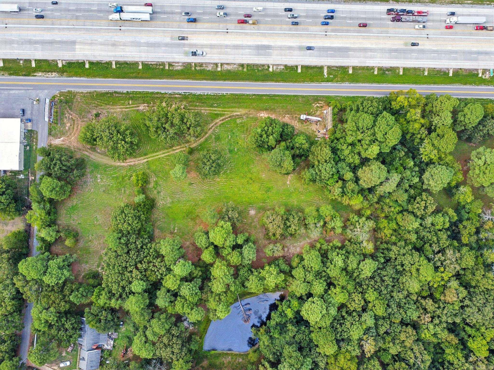 Located at the corner of S Beggs and the south service road west of the Haskell exit, this approximately 6 acre tract is open for your ideas and has unlimited potential. With no restrictions and utilities available (Seller says water, gas and 3 Phase electric) located on Beggs Road, this property presents possibilities for development for a subdivision, warehouse space, for new projects or relocation of your current business. Located on the opposite corner of a manufacturing company. Please note: The billboard company owns the signs and a small area around each sign. Billboards do not convey with this property. The area around the billboards is approximately 60 feet (length of billboard) and 10 feet on each side of each sign. Land is owned by Lamar sign company of .023 acres around each sign. Call your agent or me to set up a showing.