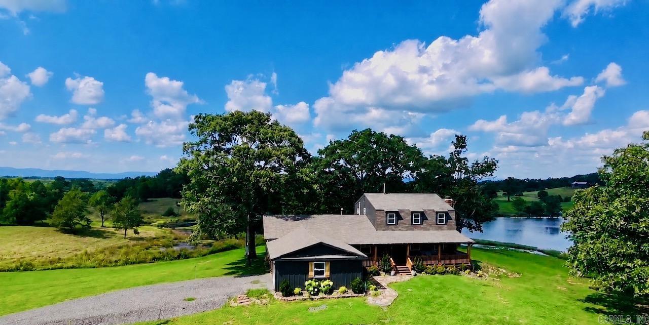 This peaceful inviting property truly feels like Home- offering breathtaking views, plush pastures, large spring-fed pond, shop with water and electric, loafing sheds, and shed. Pastures are fenced for horses or livestock. This prime property is 1/4 mile from the National Forest, sought after Airbnb location. When pulling in the long winding drive you will see this stunning completely remodeled home both inside and out. Roof approx 4-5 yrs old, new siding, new deck, new porch, new garage doors, new walk-in showers, sinks, fixtures, cabinetry, paint, water heaters, beautiful stainless appliances, farm sink, renovations throughout home. Perfect horse farm, forever home, short term rental. Owner will sell home with smaller acreage. Must see property. Beautiful home. Beautiful property. Prime location.