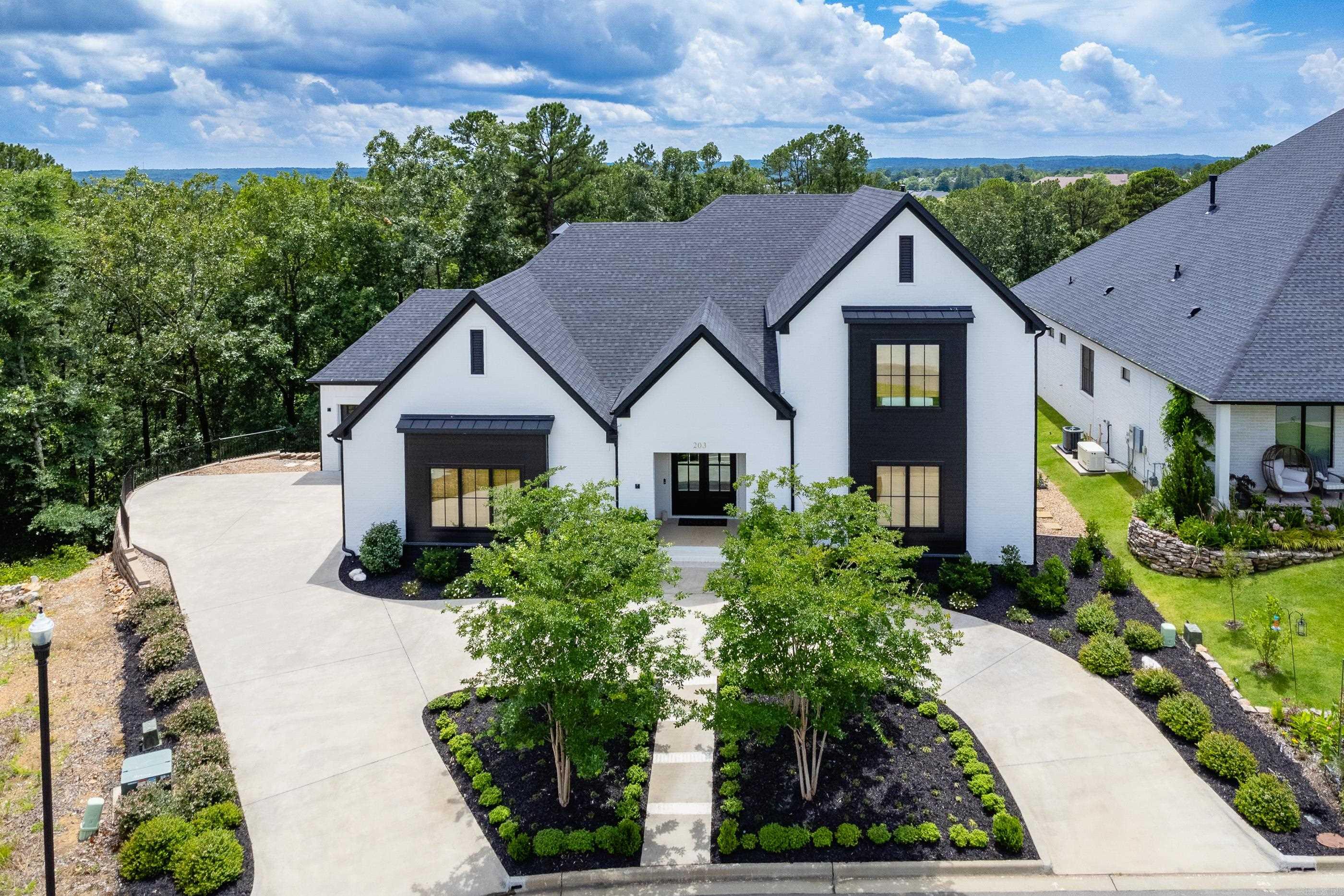 Rare level lot in Falstone. Most sq.ft. on main level w/smaller upstairs. Custom home on quiet cul-de-sac w/16'x26.5' covered porch w/FP with privacy looking onto wooded greenspace. Spacious living area w/ 13' ceilings, WBFP & built-ins. Wall of glass offers view beyond porch to the wooded privacy. Entertaining-size dining area and chef's kitchen. Top-of-the-line appliances include 2 Fisher-Paykel 2-drawer dishwashers, KitchenAid 36" 6 burner gas cooktop, Microwave drawer oven, Side by side refrigerator/freezer, KitchenAid icemaker & double wall ovens. Honed granite countertops & marble center island.  Butler's pantry offers extra storage. Primary BR w/elegant bath & 2 walk-in closets, 2nd BR & 3rd BR on main level share a Jack&Jill bath. Library/office w/built-in desk & shelves, powder room for guests & utility room with sink & storage. 2 floor-to-ceiling Armoire storage units in mudroom. Upstairs bonus room w/wet bar & beverage refrigerator.  Music/Media room finished w/carpeted walls & floor+insulated on all 6 surfaces w/acoustic blocking. 4th BR w/ built-in cabinets & 3rd full bath. Sellers built to be near family & family transferred w/jobs so sellers moving. See remarks.