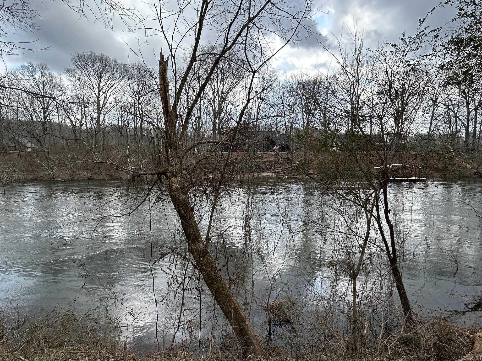Discover the rare opportunity to own a premier riverfront lot at 290 Raintree Valley in Pangburn, Arkansas, perfectly positioned on the wooded banks of the world-renowned Little Red River. This exceptional 1 acre parcel sits in one of the river’s most coveted stretches, surrounded by well-appointed  homes in an established neighborhood that reflects quiet elegance and lasting value. Completely raw and build-ready, the land has already successfully passed its percolation test for septic, saving you valuable time and resources as you bring your vision to life. Imagine crafting a custom retreat where mornings begin with fog rising off the water, world-class trout fishing is steps away, and panoramic river views create a serene, timeless backdrop for everyday living. Act now to secure your chance on a legacy property in a desirable riverfront setting where natural beauty and thoughtful development converge.  The Little Red River is calling, will you answer?