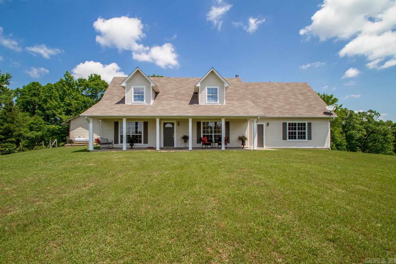 Great setting house on the hill with long front porch, Back porch also large and great for entertaining. Large great room that over looks the property. Second living area that overlooks the kitchen , new counter tops  are being installed . Master has  tile custom shower with large walk in closet. Upstairs has  two bedrooms with bath
