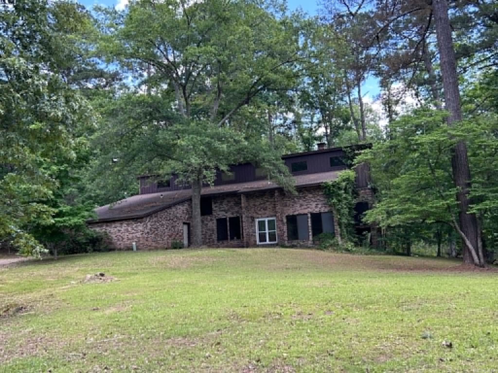 Room to Spread Out!  A private country feel just outside the city limits on 6.75 acres with 5 Bedrooms and 4.5 Baths   Your new home offers formal rooms as well as a huge family room, an exquisite kitchen with nearly new appliances and granite countertops galore + an island next to a sunroom/breakfast nook with a cooktop & French doors to the large back porch /deck. You will see rooms with work going on and the supplies laying around - Updates have happened throughout and are still in progress; upgraded bathrooms and vanities, lots of lights and work in the family room, new paint, and much much more. It truly looks like an estate now!  Large back yard has a 6’ fence including a dog pen & drive through gates (with more acreage behind the fencing).  Style, Comfort and Rooms for Everybody!