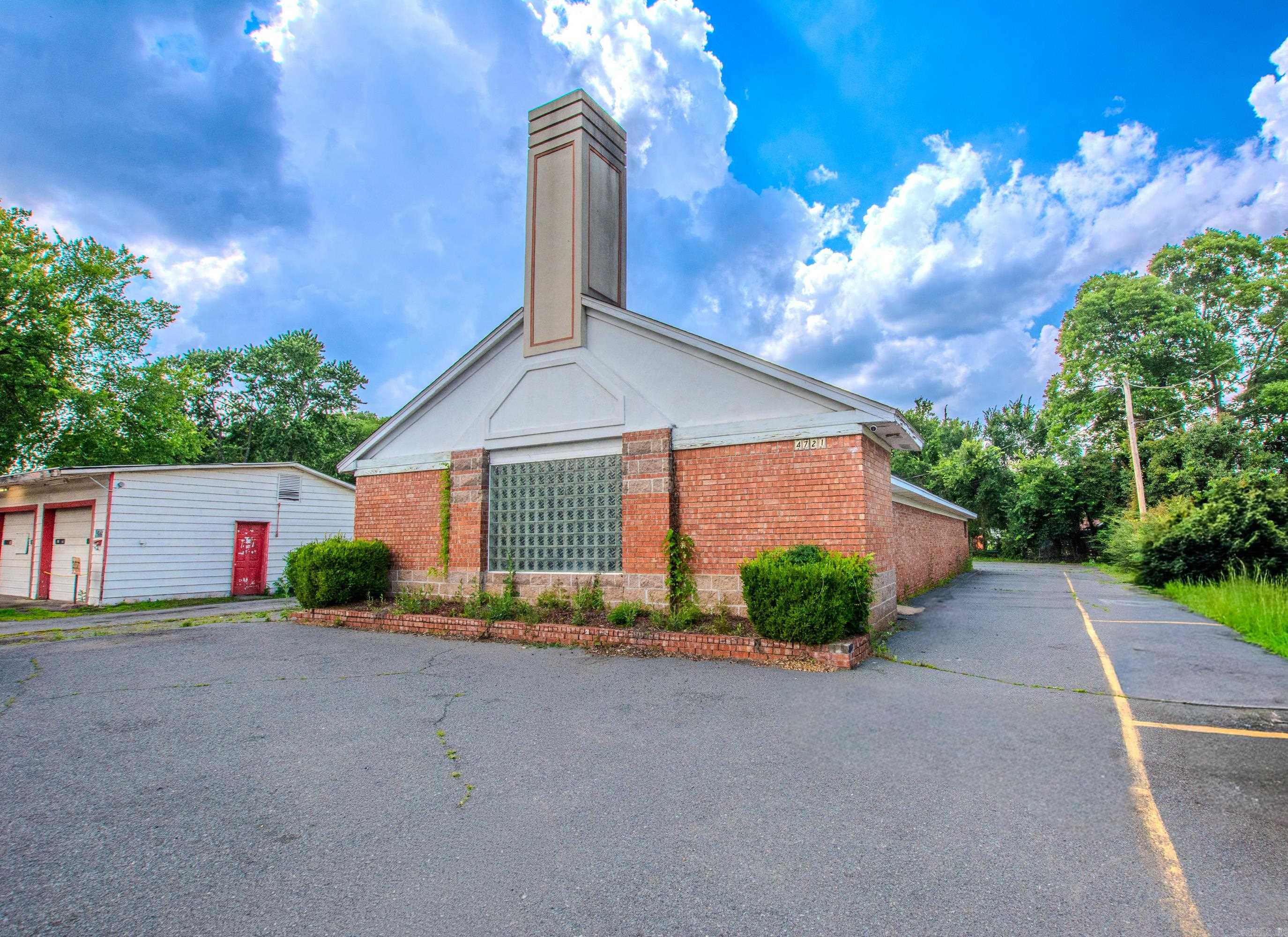 Looking for a sanctuary...well look no further! Here it is, a great starter church with lots of potential or just looking to downsize, this is the place! Beautiful large sanctuary with vaulted ceilings and pews in place, kitchen area, coffee bar area, two half baths, five offices/class rooms! Residential community church in an established neighborhood, high visibility, right on Broadway!