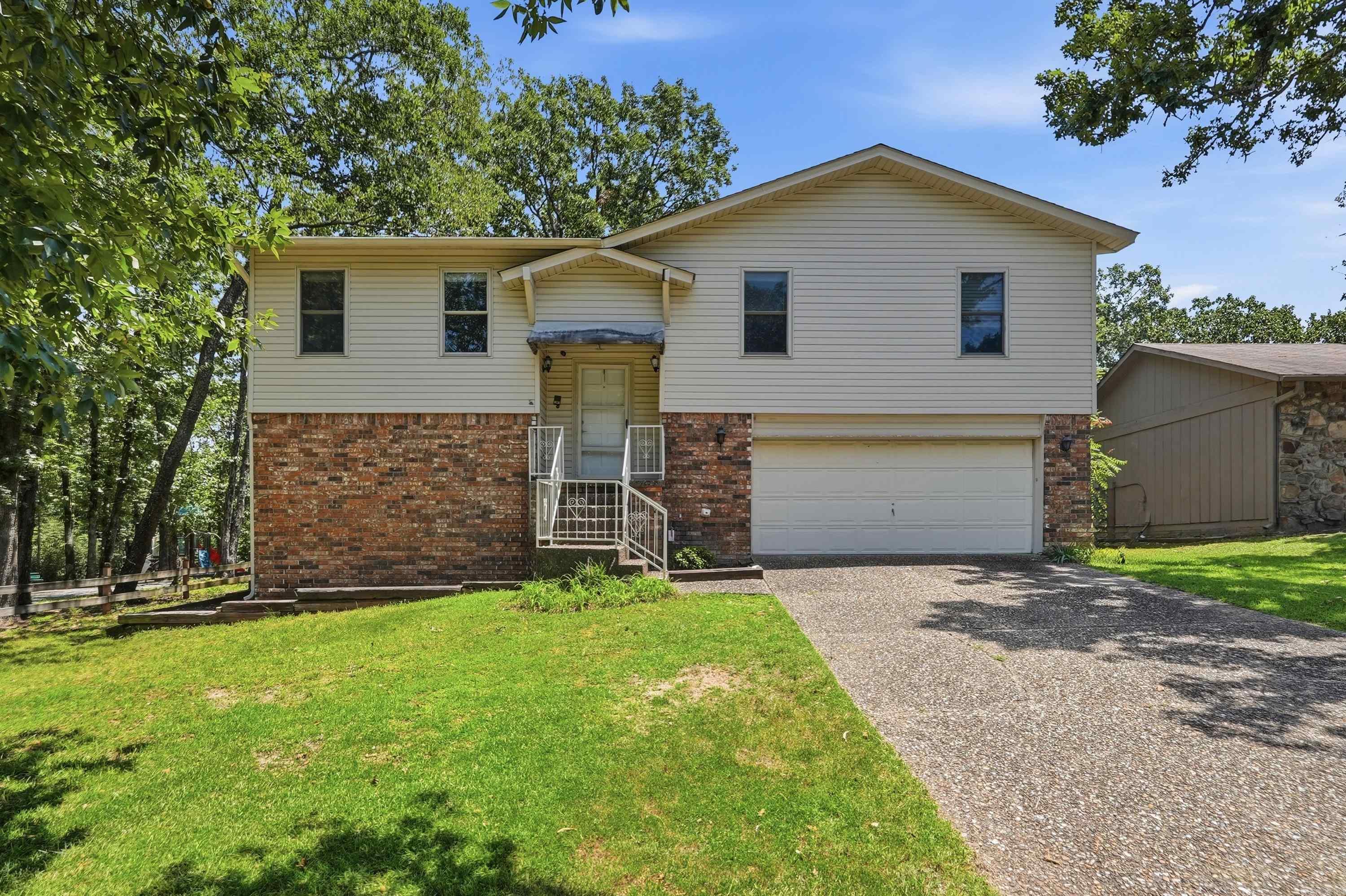 Beautifully updated 3-bedroom, 3-bath split-level home offering approximately 2,000 square feet. The main level features a spacious living room, fully remodeled kitchen with new cabinetry and countertops, three bedrooms, and two full baths. Downstairs offers a second living area and an additional full bath for added flexibility. Recent updates include new flooring throughout most of the home, fresh paint, popcorn ceilings removed, a beautifully rebuilt Trex deck with modern cable railing, and a 2-year-old roof. Situated on a large, level, fully fenced lot at the end of a quiet dead-end street next to a park, this home offers the perfect combination of updates, space, and location.