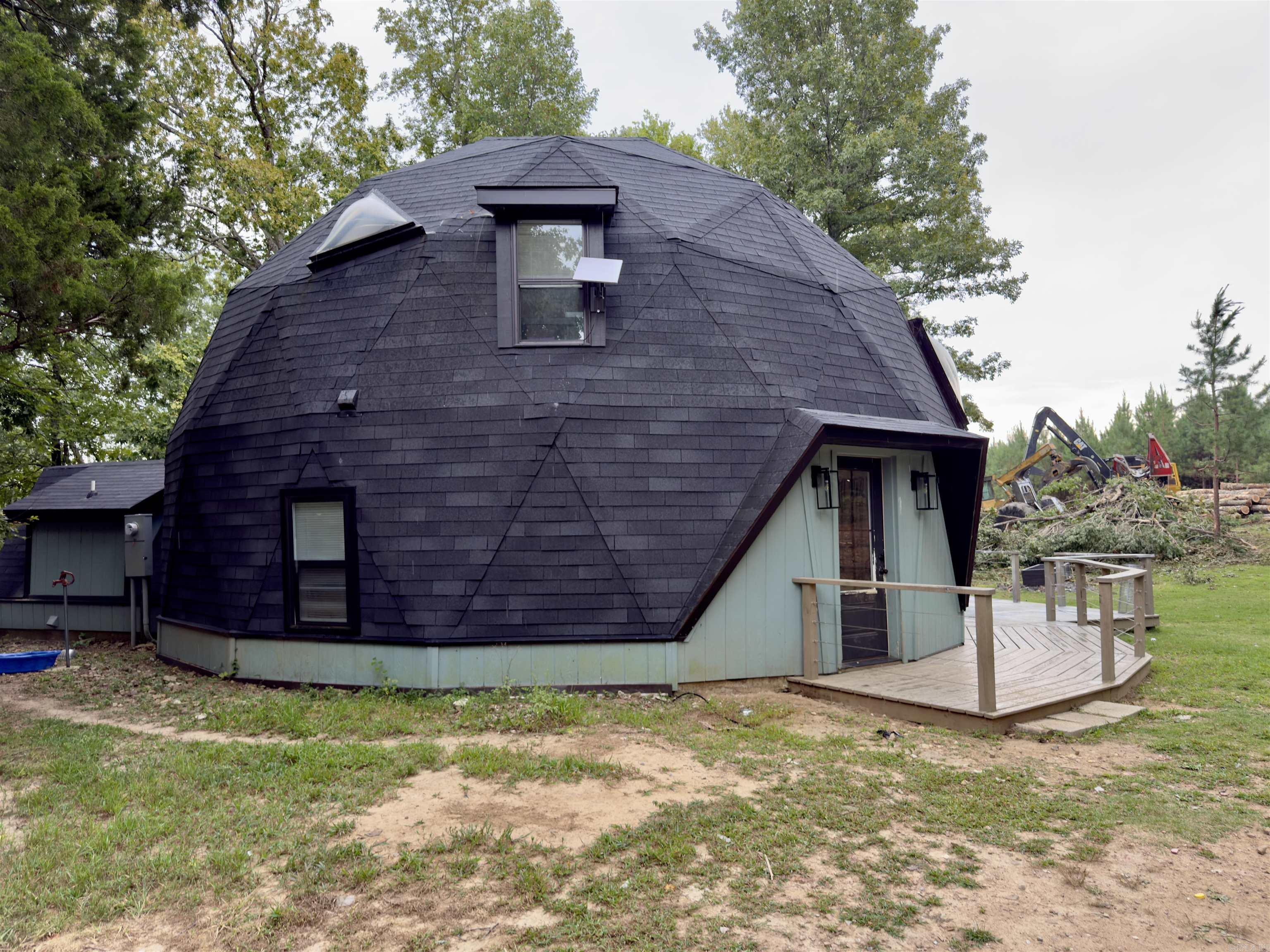 Beautifully remodeled in 2022/2023 1 bedroom 1 bath with loft Geodesic (Dome) style home on 28.59 wooded acres m/l. The home features quartz countertops, new sheetrock, new wiring, new LVP flooring, custom spiral staircase, new roof, (all in 2022/2023) and a 14x25 ft garage. Unique home could serve multiple uses such as a permanent home, vacation rental or hunting cabin. Plenty of other building spots to develop.