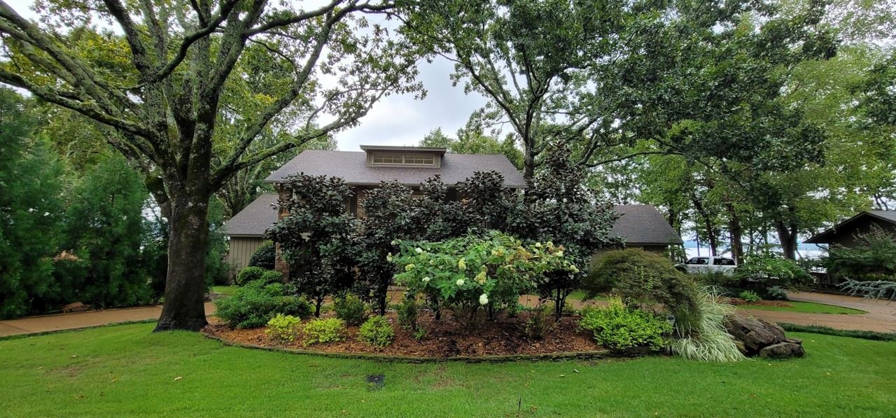 Eden Isle Lakeview home in EXCELLENT CONDITION!  This 3-bedroom home (plus office that could be a 4th bedroom) has wonderful views of Greers Ferry Lake and spectacular sunsets!  Completely updated inside and out plus many modern smart features!  Large greatroom with tall ceilings, wet bar, large deck for entertaining, 2-car garage, lots of storage, unbelievable landscaping and much more!
