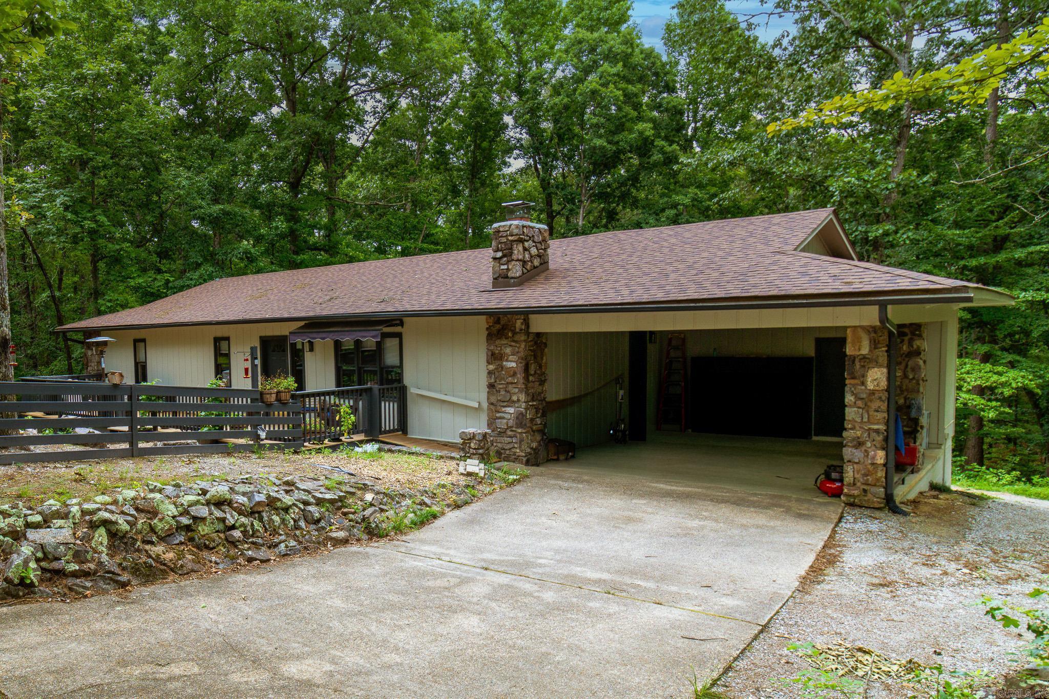 Extensively updated home on ~5 acres, offering the perfect blend of modern upgrades and rustic charm. The completely remodeled kitchen serves as the centerpiece of the home with custom cabinetry, butcher block countertops, a large center island, stainless steel appliances, walk-in pantry, coffee bar, and abundant storage. The open-concept living area features vaulted ceilings, luxury vinyl plank flooring, and a stunning floor-to-ceiling stone fireplace. Recent improvements include renovated bathrooms, a newly added third full bathroom and windows in the lower-level living area, a new main-floor laundry room, new HVAC system, new water heaters, EV Charging Outlet, new electrical panels, and a whole-house generator for added peace of mind. Main-Floor Laundry Room and another in Lower Living Area. Fiber Internet Available. The deck overlooks the serene, wooded setting, creating an ideal space while enjoying the privacy of the acreage. The adjoining property at 279 Needham Rd at ~4.25 +/- acres is also available for purchase under a separate listing 26021092, providing an opportunity to expand your acreage and privacy.