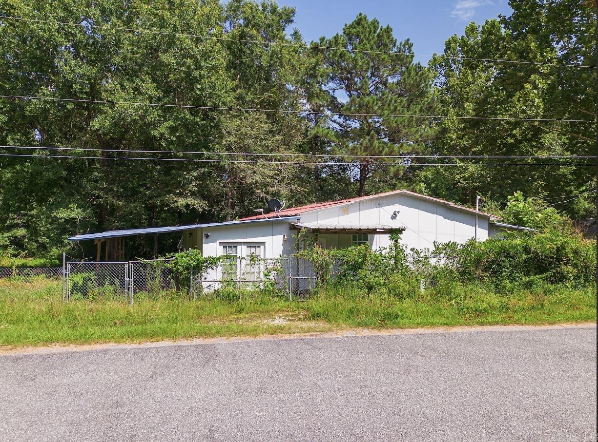 Discover the potential of this unique 2-bedroom, 1-bath property offering approximately 2,000 square feet of space on 4.48 beautiful acres with convenient paved road access.  The unfinished areas provide endless opportunities to customize the property to fit your vision- whether you're looking to create your dream home, a spacious workshop, a weekend retreat, or a combination of all three.  With plenty of room to expand and make it your own, this property is ideal for buyers seeking flexibility and acreage in a peaceful setting.  Property is being sold as is, in it's current conditions.