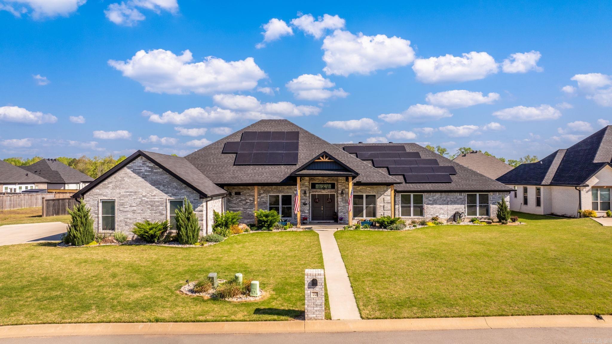 This large single-story home offers over 3700 square feet of thoughtfully designed living space on a flat, double lot. The open concept layout showcases an open kitchen with island, additional countertop space perfect for coffee nook or bar, walk-in pantry and an eat-in area overlooking the backyard.  There's also a separate dining space for more formal gatherings. Two large bedrooms include private en-suite bathrooms and walk-in closets. A dedicated office with French doors and a closet offers flexibility as a workspace or potential fifth bedroom.  The beautifully landscaped yard has irrigated front flower beds, a patio with pergola, outdoor fireplace and two sheds. A three car garage adds even more space for storage and includes a safe room.  This nearly new home offers a a combination of space, style and functionality. Agents, see remarks.