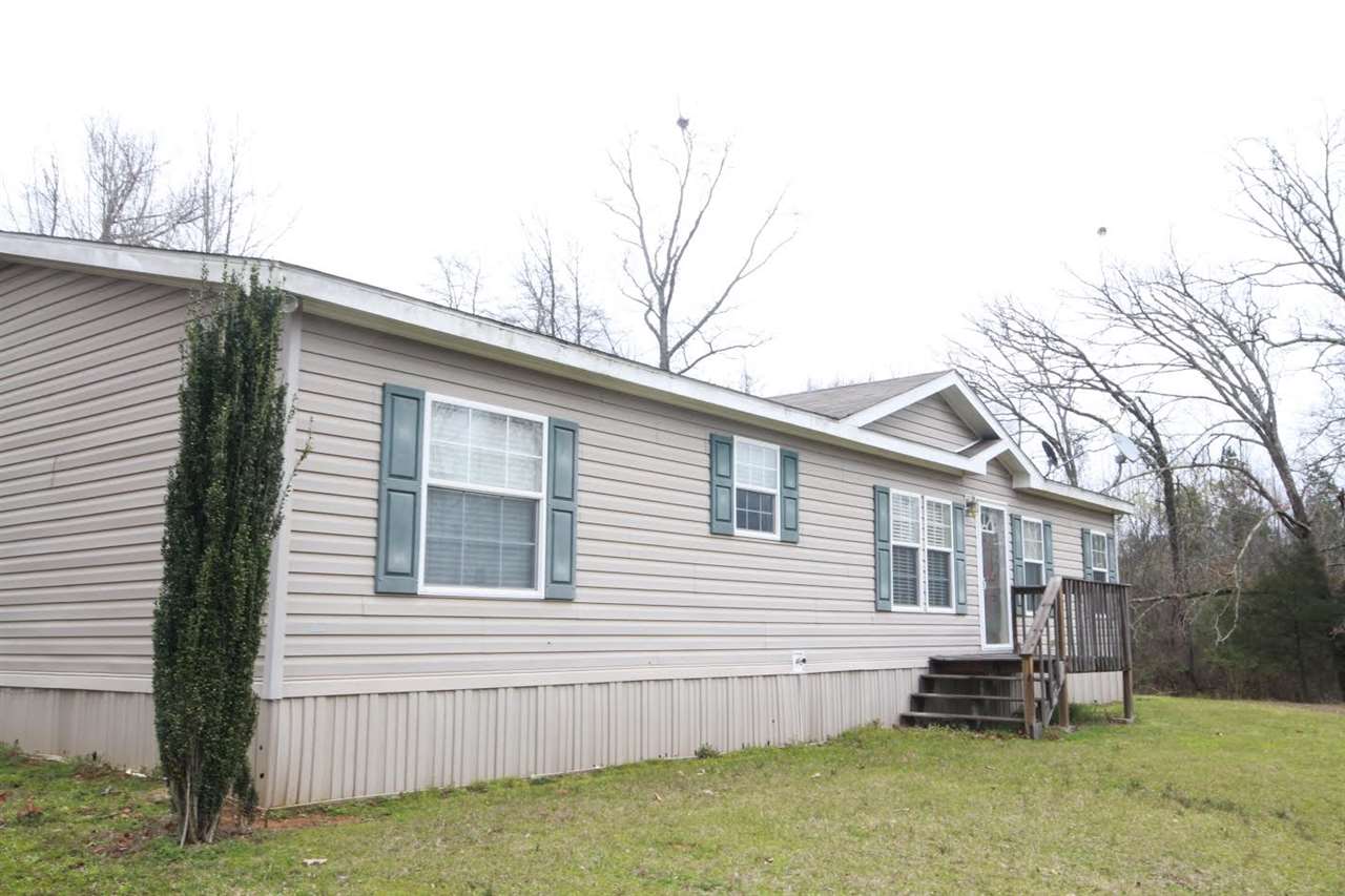 Mobile home on 6 acres in Vilonia School District!  Comes with washer/dryer and refrigerator!  Also has WBFP, jet tub, lots of cabinets, double vanities and an office area.  All electric, comes with storage building.  This is a Southern Energy 32x56 and per seller is on a permanent foundation.  See agent remarks.