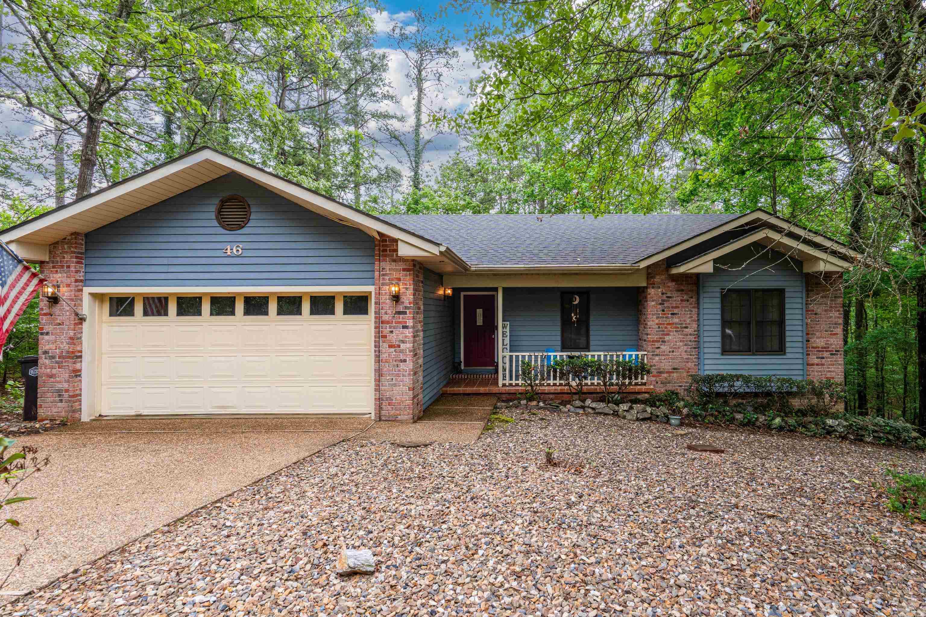 Tucked among the trees in sought-after Hot Springs Village, this lovely home offers a private, secluded setting that feels like a true treehouse retreat. Surrounded by nature, the property delivers both tranquility and convenience in an exceptional location. Inside, you’ll find three bedrooms and two baths, complemented by tasteful updates and inviting décor throughout. Warm, cohesive colors and thoughtful finishes create a comfortable, move-in-ready environment. The main living spaces flow easily, while an additional den and sitting area provide flexibility for relaxation or entertaining.  The lower level expands the living space with a bonus room and additional gathering area—ideal for hobbies, guests, or a quiet escape. A two-car garage offers ample storage, adding everyday practicality to the home’s charm. Located in a premier community known for its lifestyle amenities, residents enjoy access to nine golf courses, 11 lakes, pickleball and tennis courts, swimming, and a wide range of recreational activities. Whether you're seeking a full-time residence or a peaceful retreat, this property delivers.