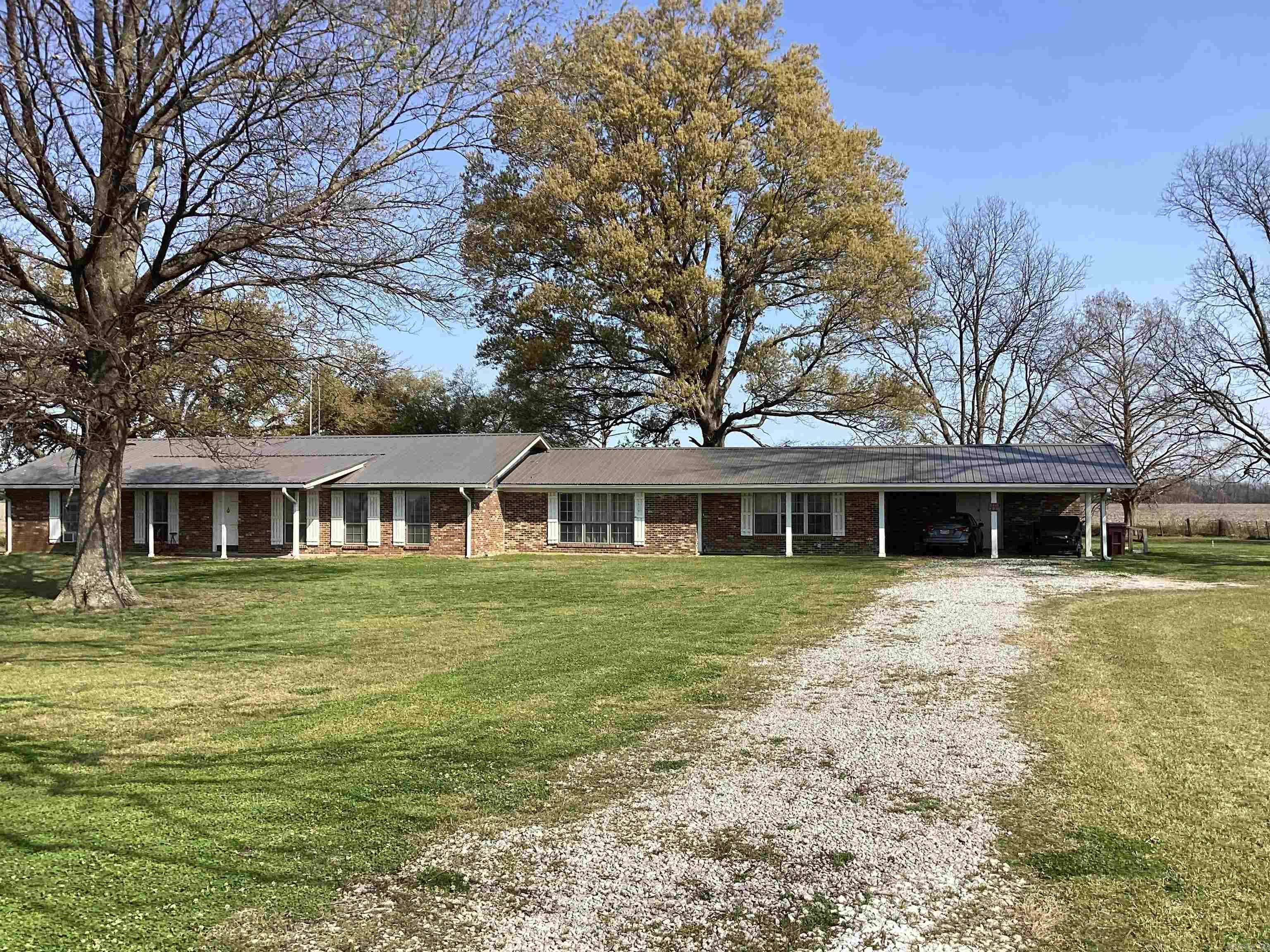 Spacious and inviting, this 4-bedroom, 3-bathroom home offers approximately 2,973 square feet of comfortable living space, perfectly situated on 1.89 acres. This property features a newer metal roof, newer HVAC system, and a newer hot water heater, providing added peace of mind. The home includes a newer septic tank system and boasts a beautifully remodeled master bathroom shower.  Enjoy newer flooring throughout, enhancing the home's fresh and modern feel. The beautifully newly installed French doors bring in abundant natural light and create a seamless transition to outdoor living. Conveniently located just minutes from Grand lake, this property offers the perfect blend of peaceful country living and outdoor recreation.  With plenty of space inside and out, this property provides both comfort and room to grow. Don’t miss the opportunity to make this spacious property your next home!