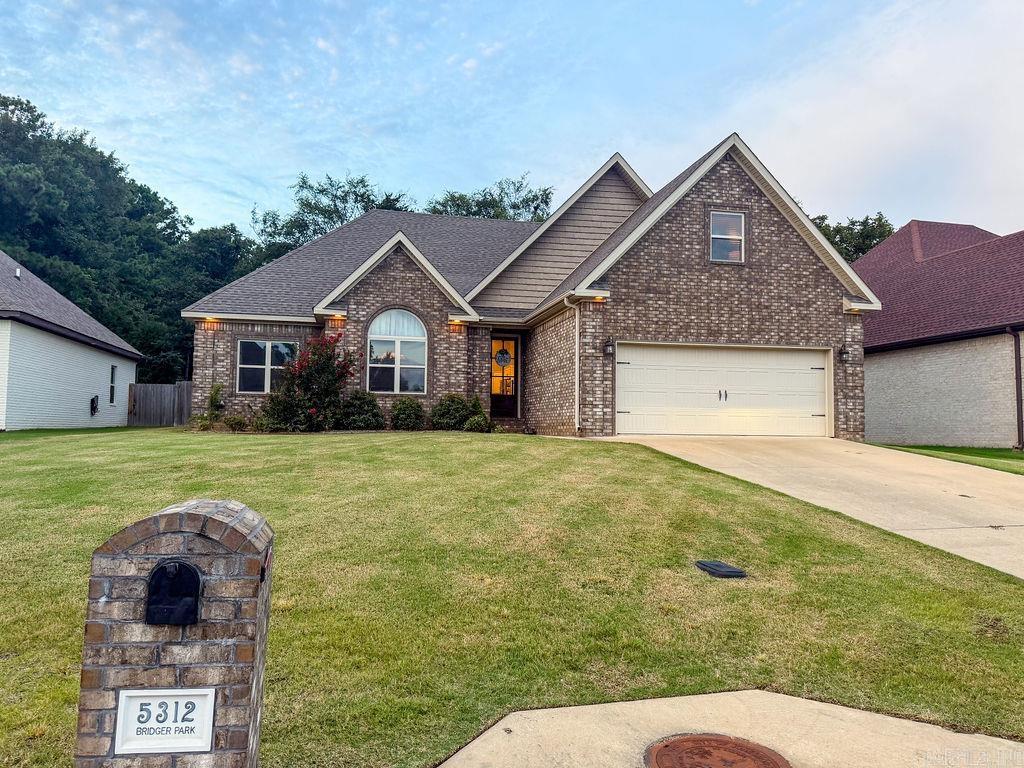 Welcome home to this beautiful brick 4- or 5-bedroom, 2-bath home featuring tall ceilings, a cozy fireplace, and an open, inviting layout perfect for everyday living and entertaining. The spacious living area flows seamlessly into the kitchen with stainless gas cook stove, where a breakfast bar provides the perfect spot for casual dining, morning coffee, or gathering with family and friends.    The flexible floor plan offers the option of a fifth bedroom upstairs, home office, playroom, or hobby space to fit your lifestyle. Step outside to enjoy the screened-in porch overlooking the privacy-fenced backyardan ideal place to relax, entertain, or let pets and children play safely.    With its spacious design, and most of the square footage being on one level this could be a good home for someone bringing in an aging parent too.     I would be remiss to mention the endless hot water provided by the tankless gas water heater.