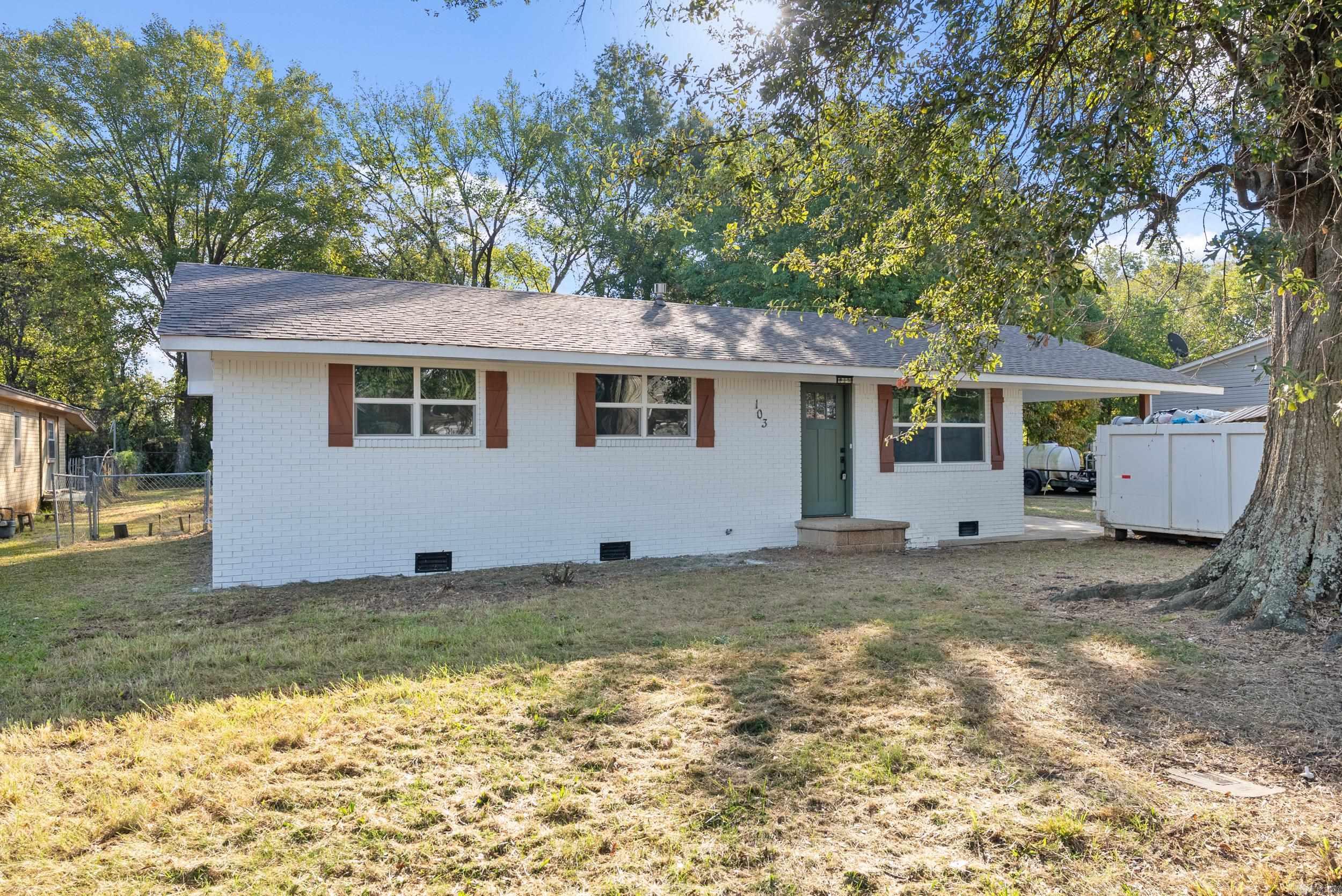 Beautifully remodeled home framed by a mature shade tree in McCrory! New HVAC condenser, new water heater, new windows, and a new roof! The new roof should save lots of money on insurance costs and new windows should help keep electric bills low. Open floor plan with large living room that is open to the kitchen. Kitchen features all new appliances and granite countertops. New paint and fixtures throughout the home. The gorgeous luxury vinyl floors complement the paint colors very well. Large laundry room just off the kitchen. 3 bed/2 bath. The partially fenced back yard is flat and has shade. It has great potential for creating the perfect outdoor space for entertaining. One car carport. Convenient location in town close to schools, shopping, and dining.