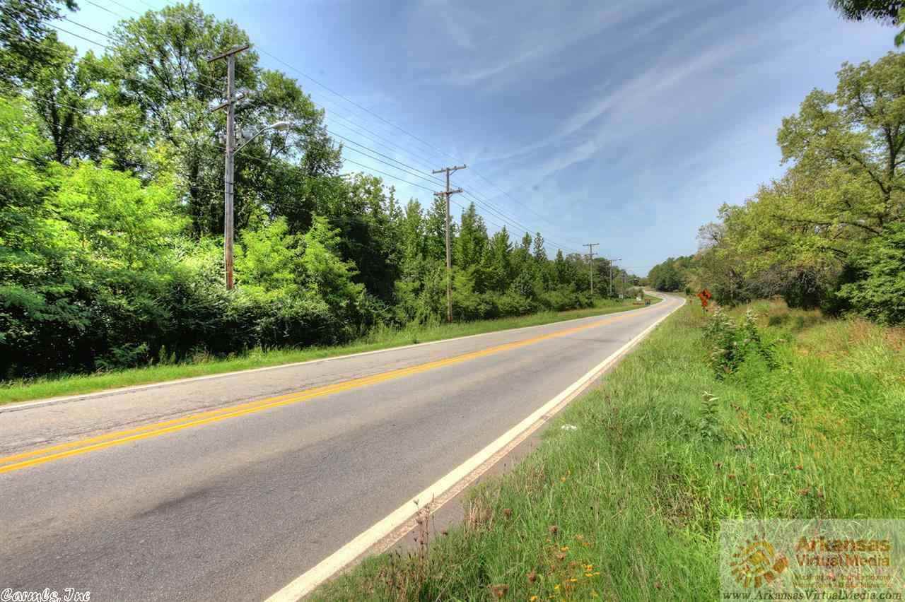 5 minutes from I-40 and 2 miles from new interchange. This 68 acres overlooks Lake Beaverfork. Frontage on Hwy 25. City water, beautiful rolling land with timber. Great to Subdivide.