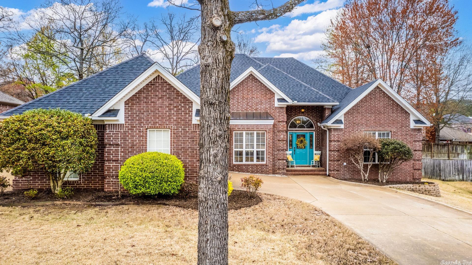This is a fantastic 4 Bed 2 Bath on a quiet cul de sac just a block from the beautiful Lake Willastein park in Maumelle. Inside you’re welcomed with a tall ceiling foyer, freshly painted walls, and hardwoods at the entry which opens nicely to your large box ceiling living with the gas log fire and wonderful two story high ceiling dining.  Your kitchen highlights the granite breakfast bar, glass tile splash and access to the covered back patio, overlooking your flat and privately fenced yard. Privately set apart is the oversized Primary suite with the updated double vanities, brand new walk-in shower, jetted tub, and spacious walk-in closet. To the right of the foyer is 3 Beds & fully updated bath with new floors, counters, and new double vanities. One of the guest beds has private access to the back patio. Don’t miss the laundry by the 2 car side entry workshop garage with a staircase that provides easy access to the floored attic for great storage space.