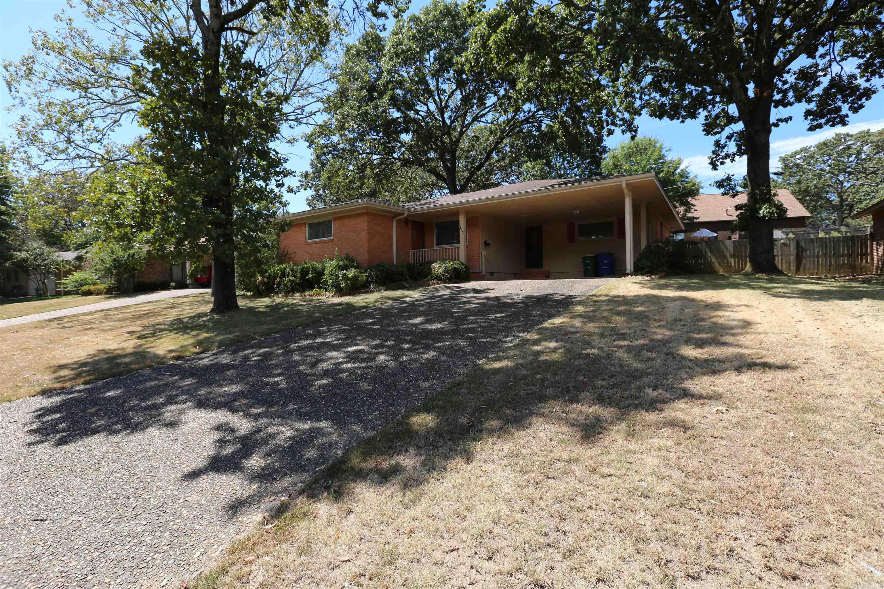 Marvelous residence featuring three bedrooms and two bathrooms with an expansive open living area. The kitchen is exceptionally large, offering ample counter space for culinary endeavors, complemented by a convenient breakfast bar. Adjacent to the kitchen, you'll find a roomy laundry area. Step outside to discover a covered patio and a fenced yard, providing both privacy and outdoor enjoyment. Additionally, there's a practical two-car carport for your convenience. AGENTS PLEASE SEE REMARKS.