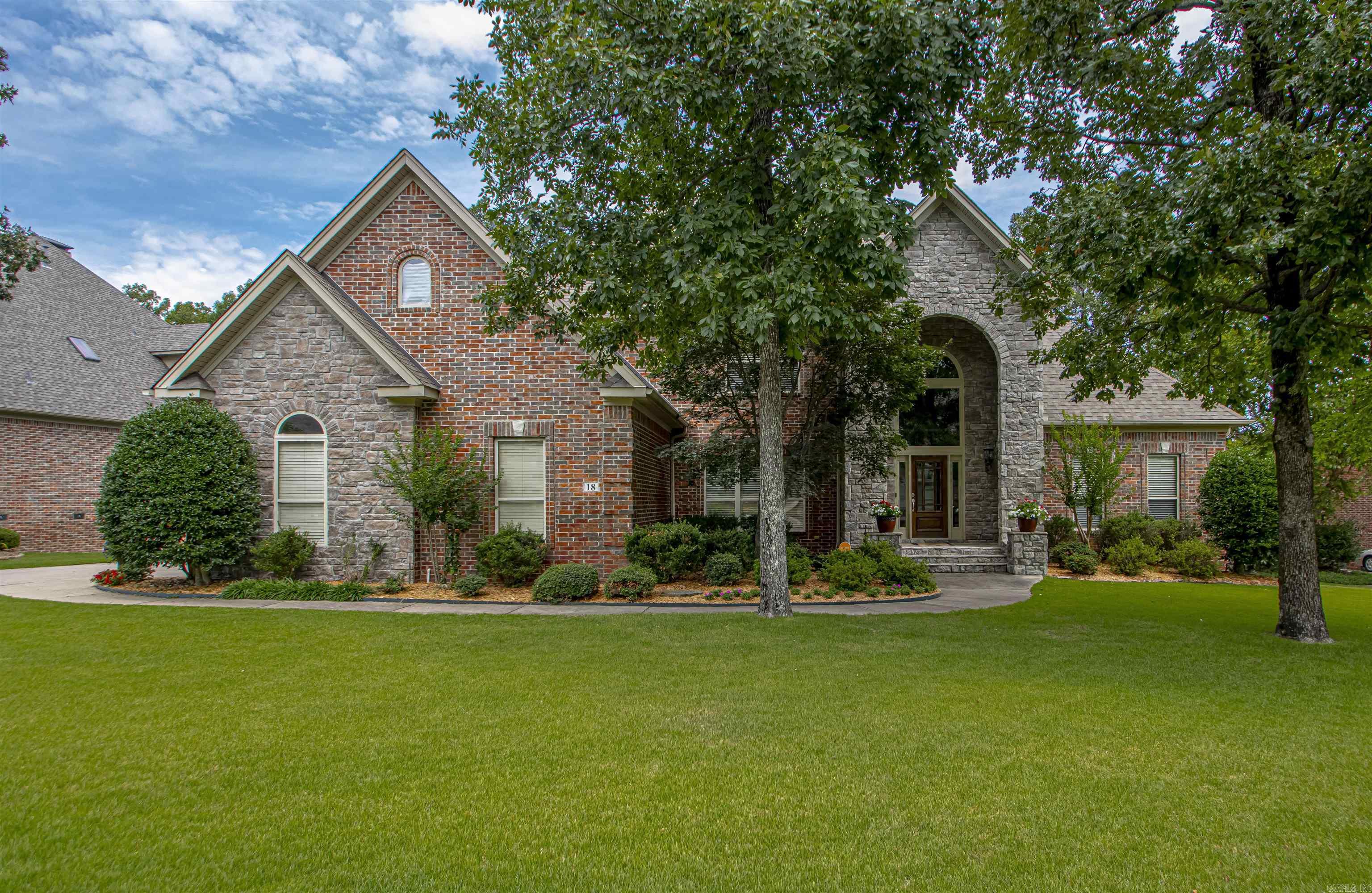 This wonderful, traditional home in Chenal sits on a large level lot with side loading 3 car garage.  A 2 story foyer greets you with hardwoods, new light fixture and lots of natural light.  The main level includes the dining room, great room, expansive kitchen with hearthroom,  the primary bedroom and bath, and a second bedrm(currently an office) and ensuite bath.  Upstairs you will find 3 additional bedrooms with ensuite baths, a bonus room and an office(or 6th bedroom).  So many options on the space utilization.  Lots of storage with 2 walk in attic spaces, walk in closets and underhouse storage.  Nice covered deck to enjoy the outdoors.  AGENTS--PLEASE read remarks BEFORE  scheduling a showing.