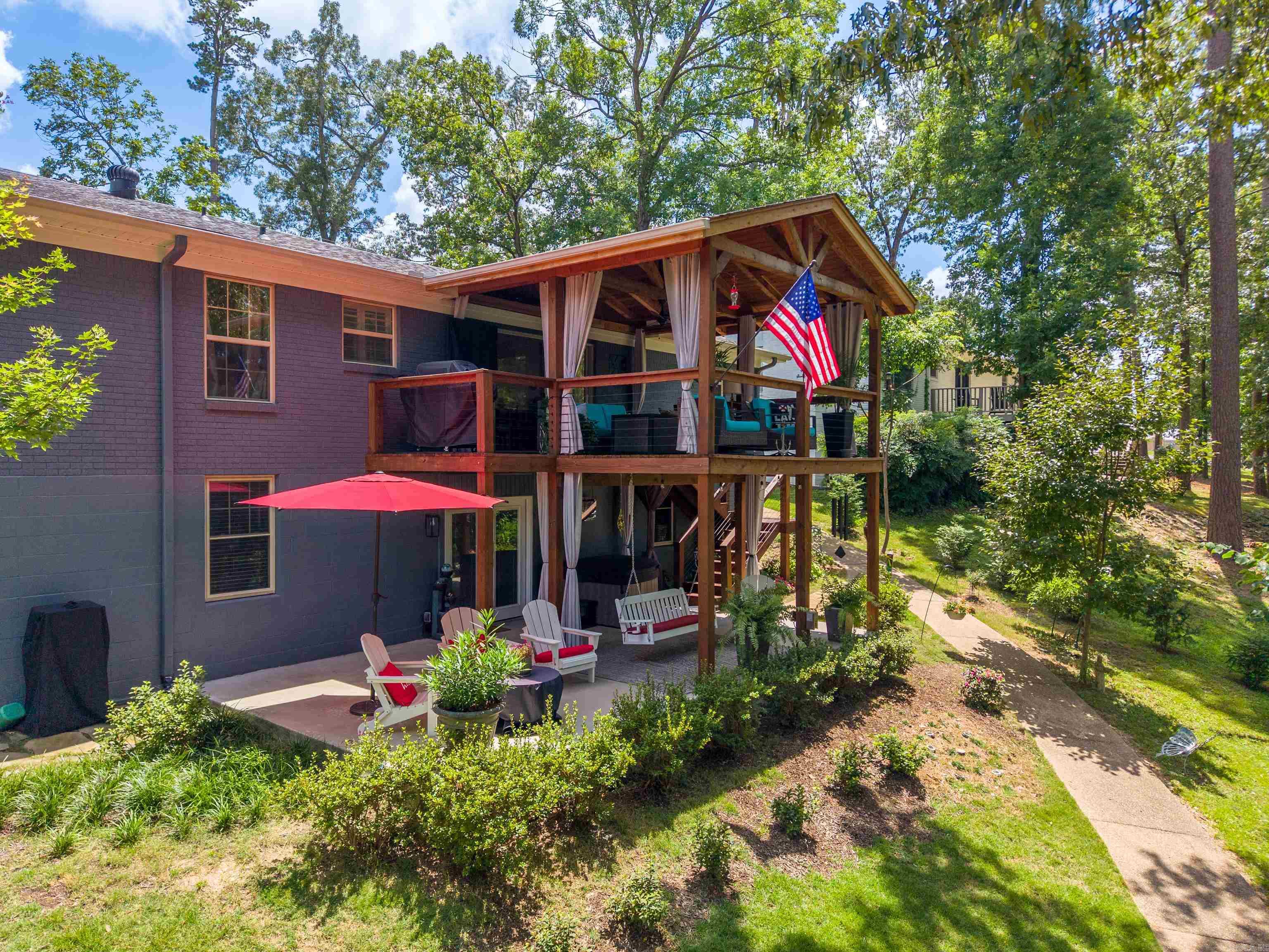 Enjoy lake living at its finest in this beautifully remodeled lakefront home!  Situated in a protected cove, this home has a custom-built covered boat dock with a lift, professionally designed landscaping with irrigation and accent lighting that is stunning both day and night. The home is immaculate and in move in ready condition featuring a continuous hot water tank, stylish kitchen with quartz countertops and quality finishes throughout. The square footage includes a bonus room well suited for additional entertaining.  Step outside to your back deck - an ideal setting for relaxing or entertaining. A large shop is also an added bonus.  Located in an area of beautiful homes where nightly rentals are permitted, the property is close to restaurants and attractions that make this home even more attractive.  This gem won't last long, schedule a showing today!!