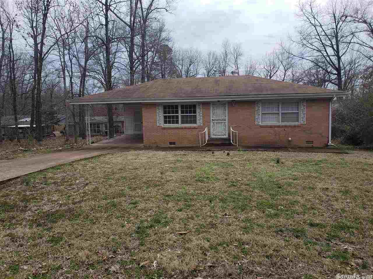 Well maintained home recently painted inside and newer wood laminate flooring in living-dining-kitchen area. Large room addn off kitchen recently made into a 3rd bdr with own 3/4 bath/laundry area. Newer 12x10 long lasting deck, workshop/storage under house and on flat lot.  New carpet in other 2 bedrooms. Tankless propane water heater, plus heat pump with gas back up.  Within just a few blocks of the park for access to Lake Sequoyah for fishing & swimming. Listed for sale also available for owner financing